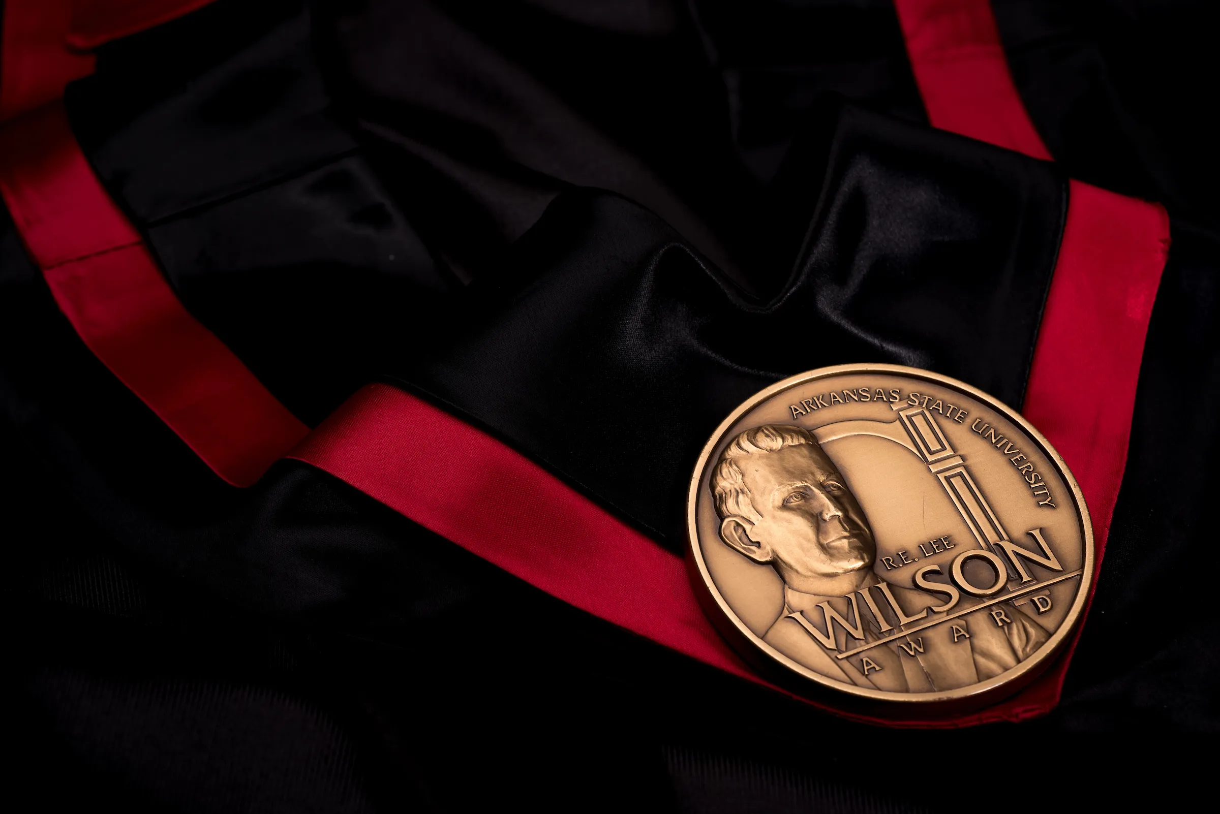 The Wilson Award medal laying on a black cloth