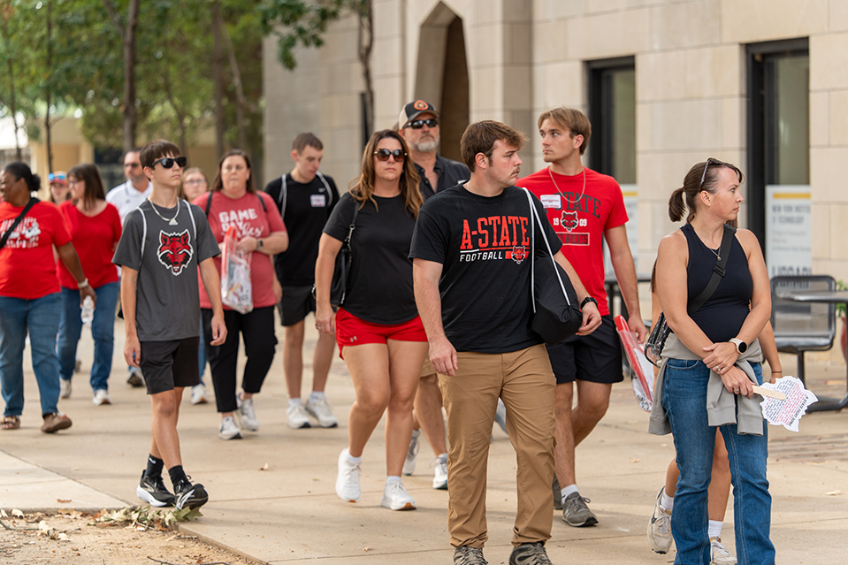 Visitors walking A-State campus