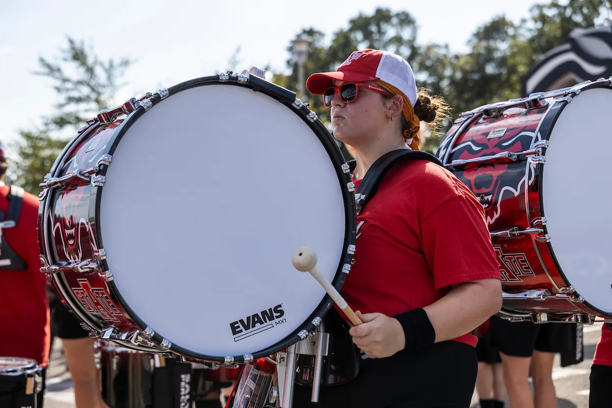 A drummer marches at a pregame event