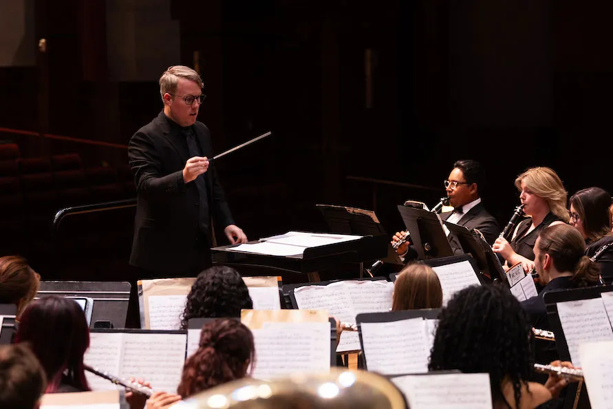 A faculty member conducts the A-State concert band