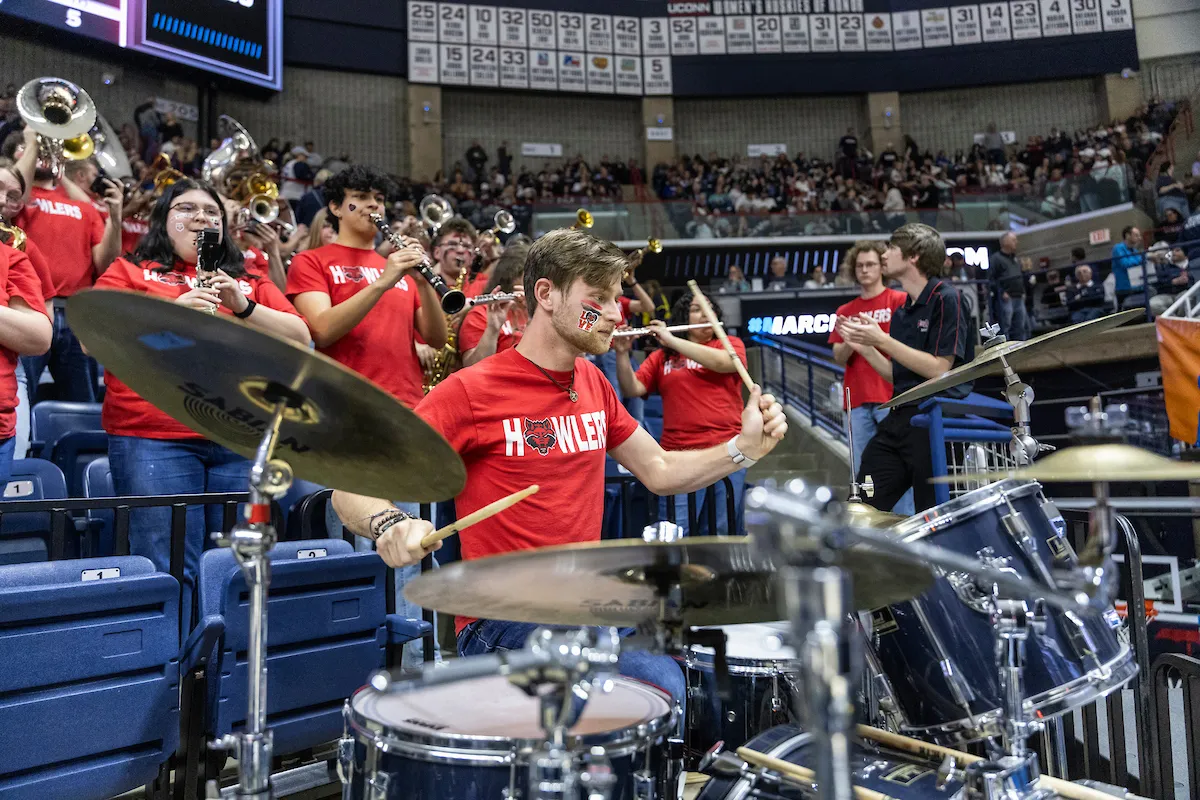 The Howlers Band drummer performs at the NCAA tournament