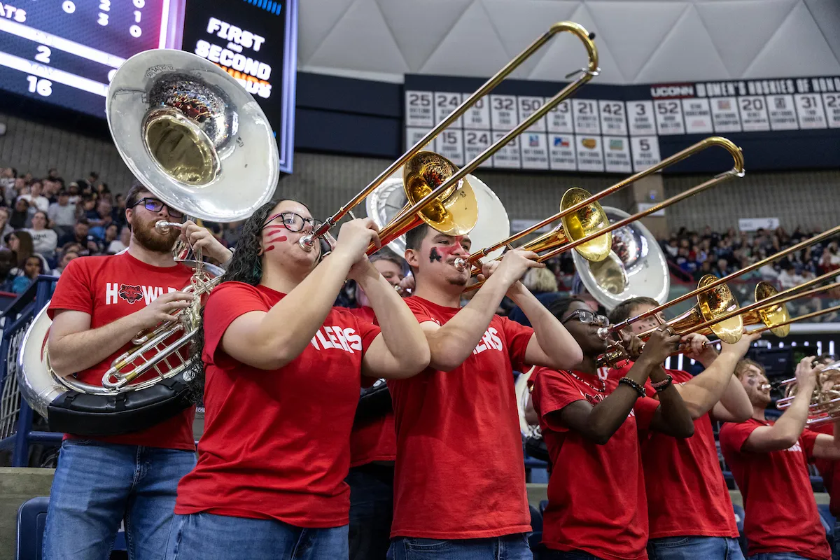 The howler pep band performs at a basketball game