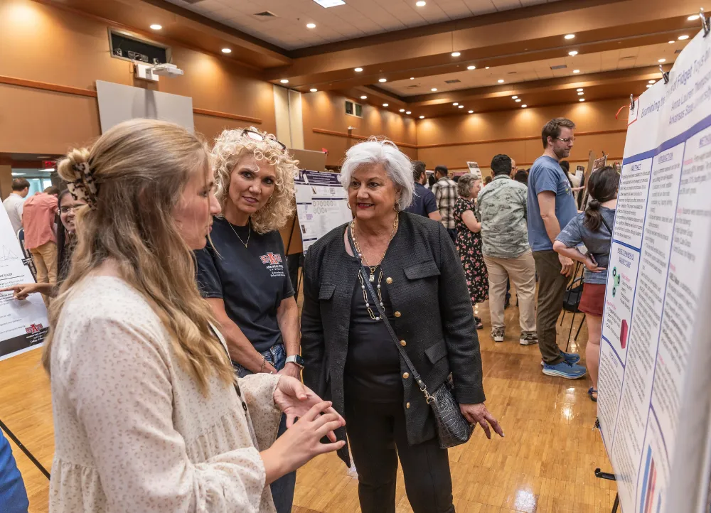 2025 create at astate student research being judged by Dr. Hux