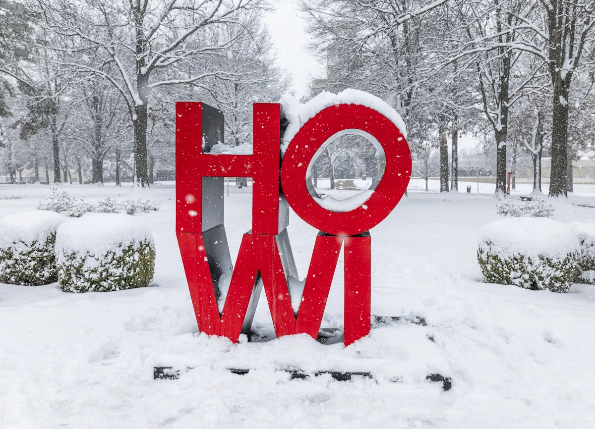 The HOWL Letters sign near the Welcome Center surrounded by snow