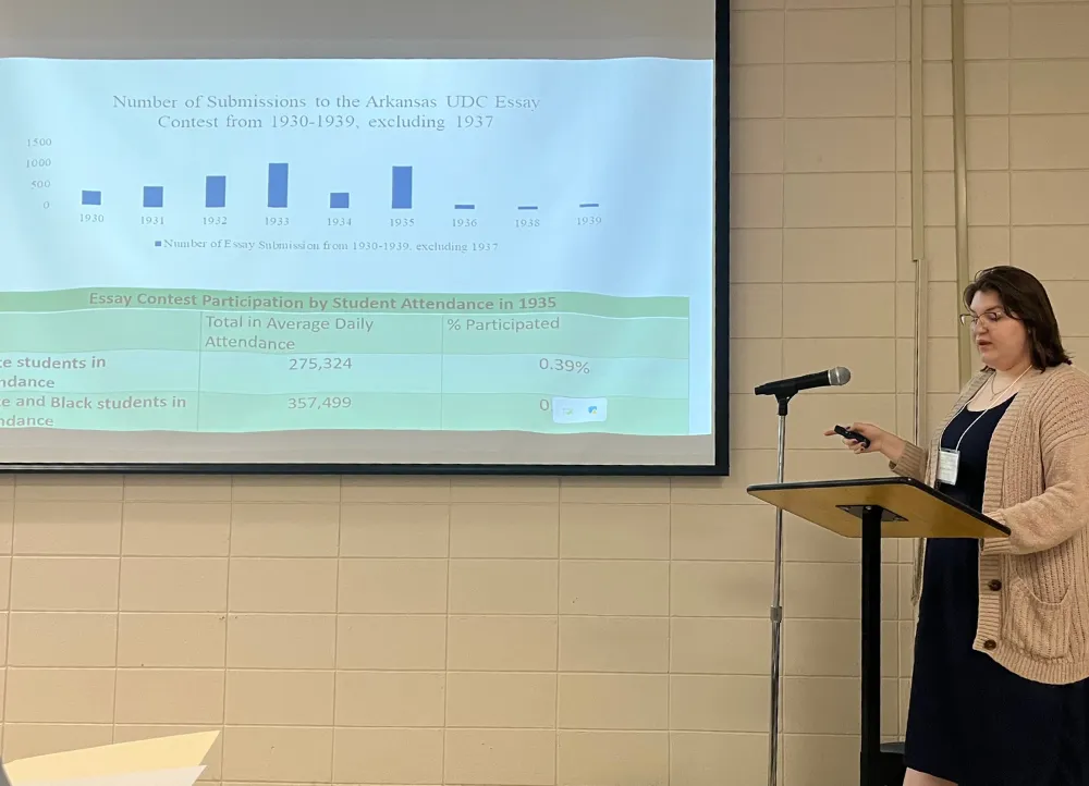 Graduate student Jamie Rawls presents her research on the Arkansas UDC