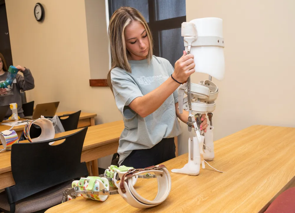 Physical Therapy student working with prostetic device.