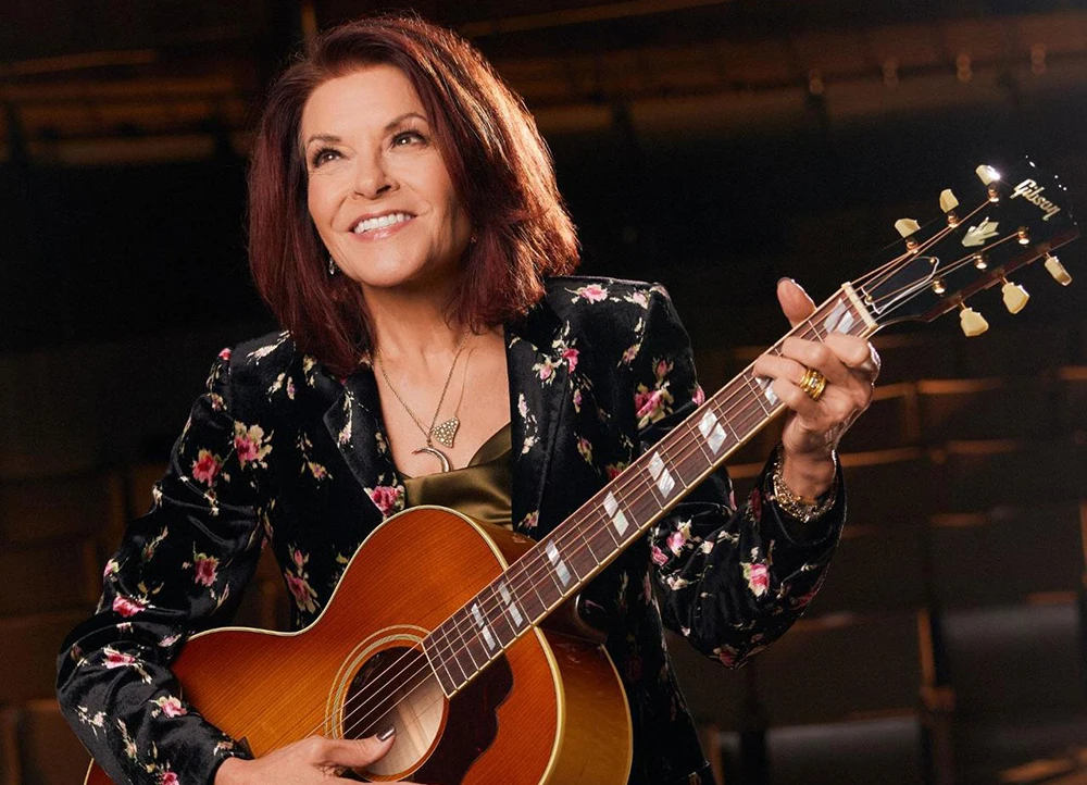 Rosanne Cash performing with guitar