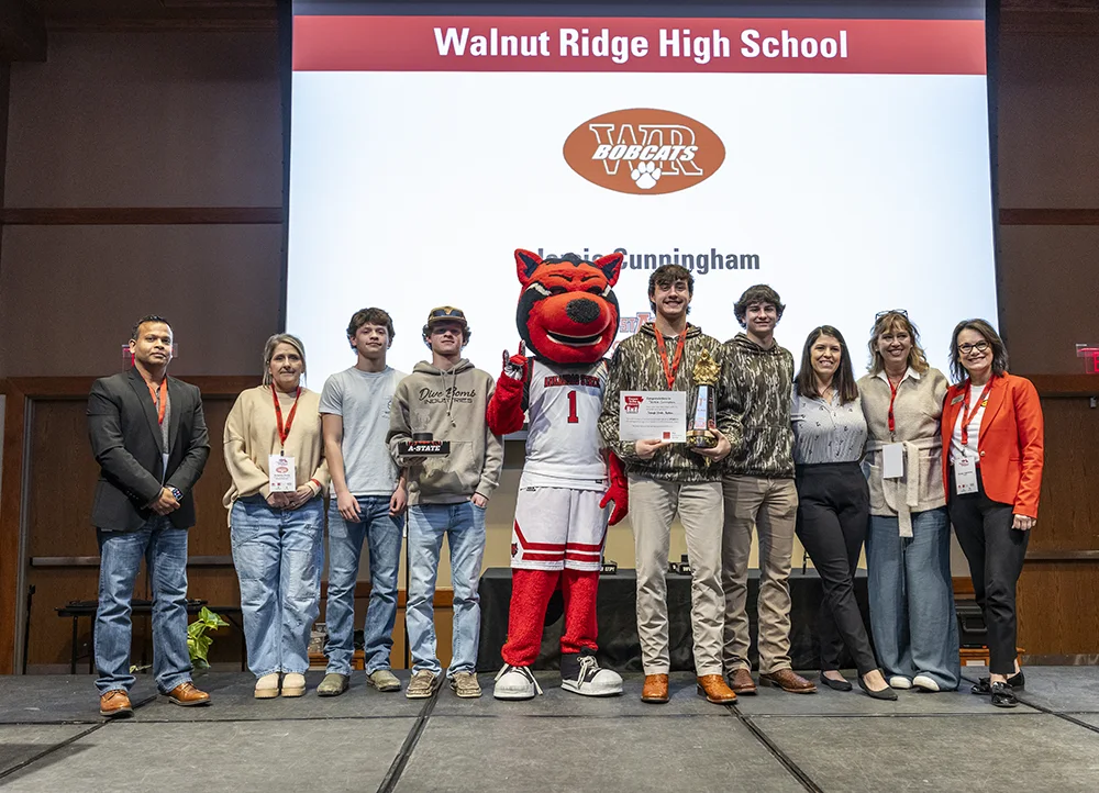 High schoolers pose with their prizes and Howl at Thrown to the Wolves.