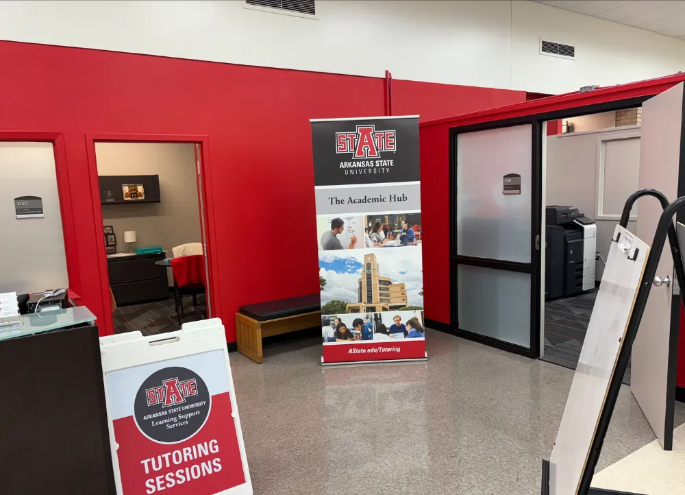 A-State’s Learning Commons South and Writing Center with seating area and help desks.
