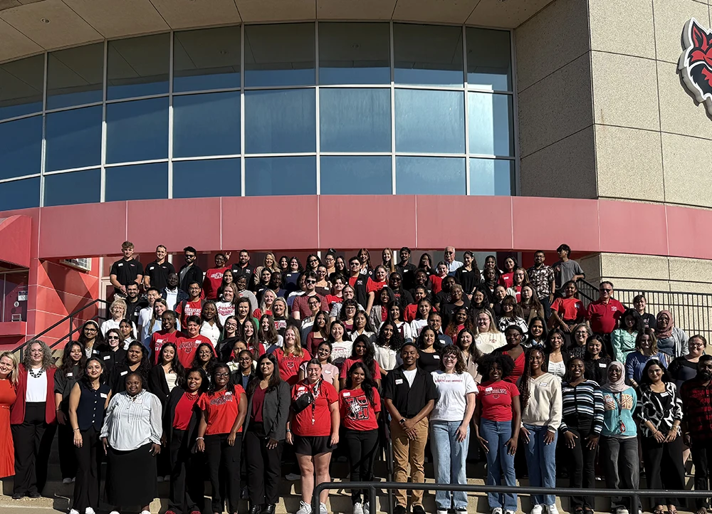 WBLC Members posing on arena steps.
