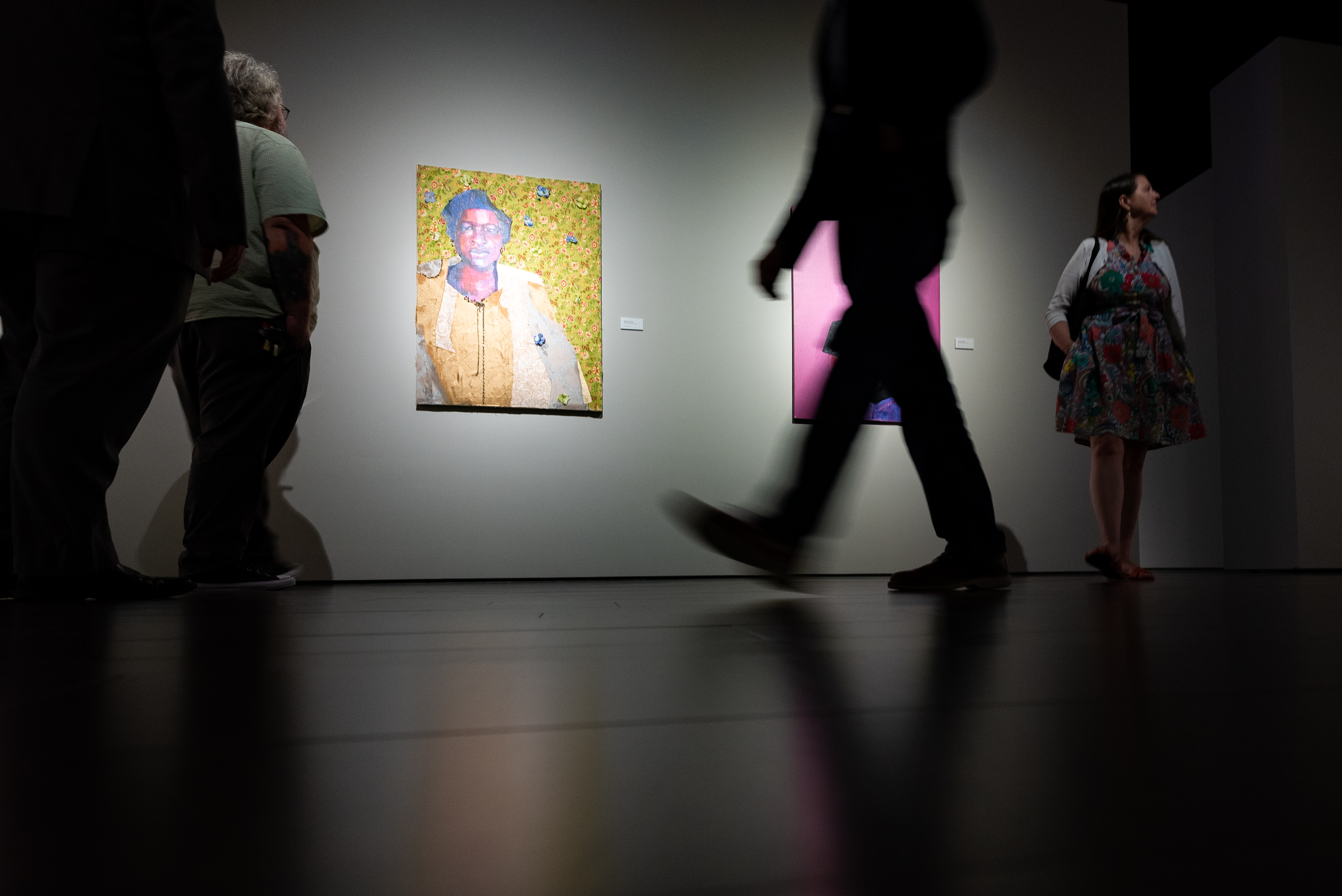 Low-angle photo of people walking through the Bradbury Art Museum