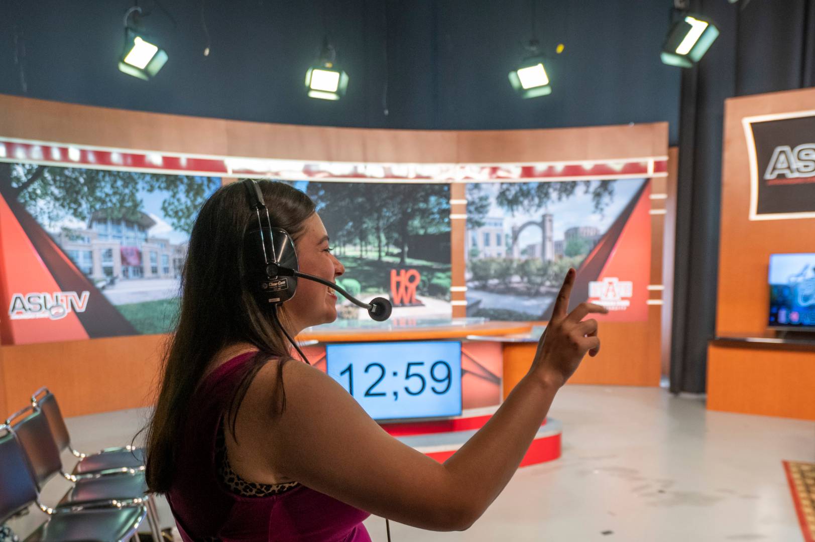 A student counting down before a television broadcast.