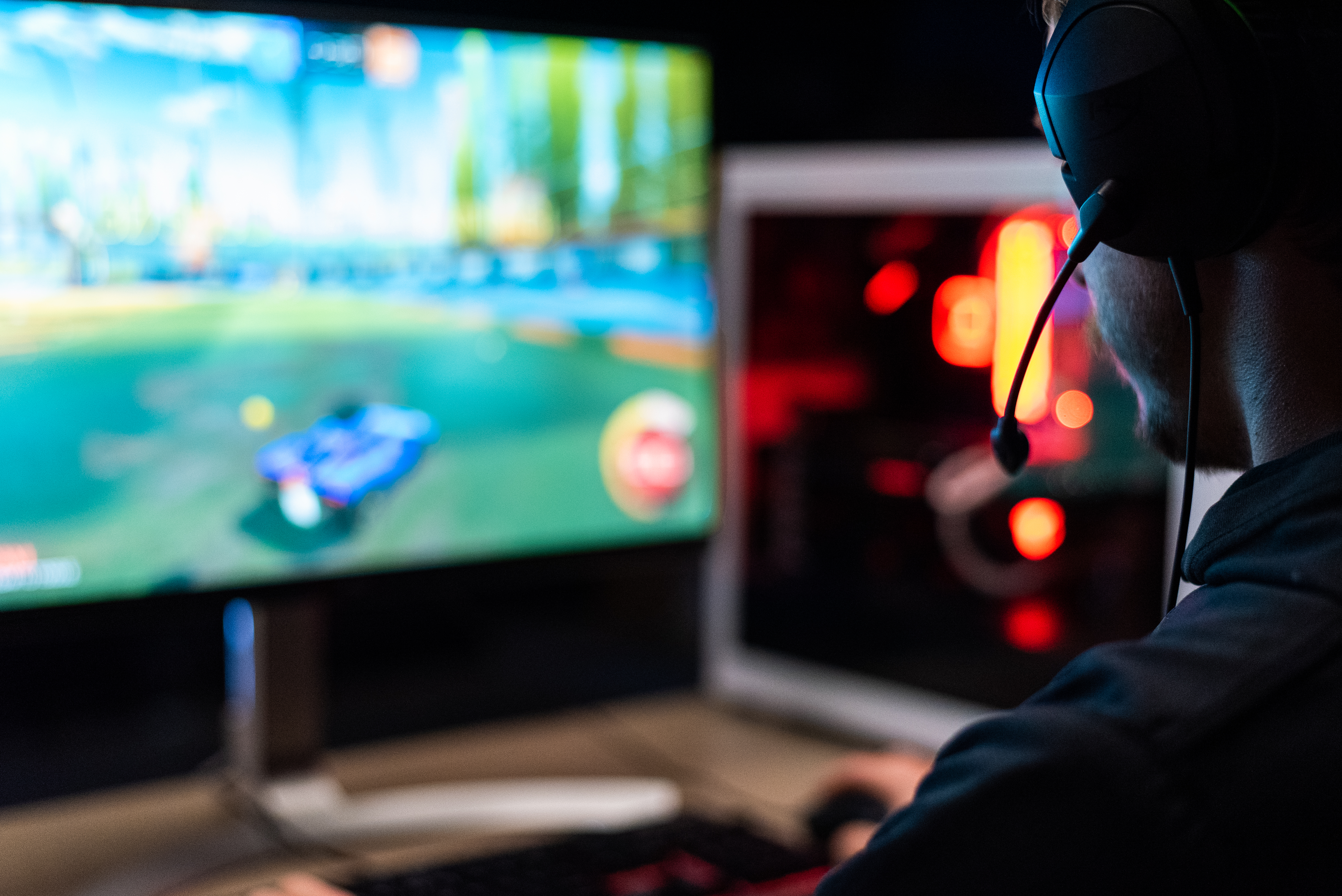 Person playing a video game on a desktop computer