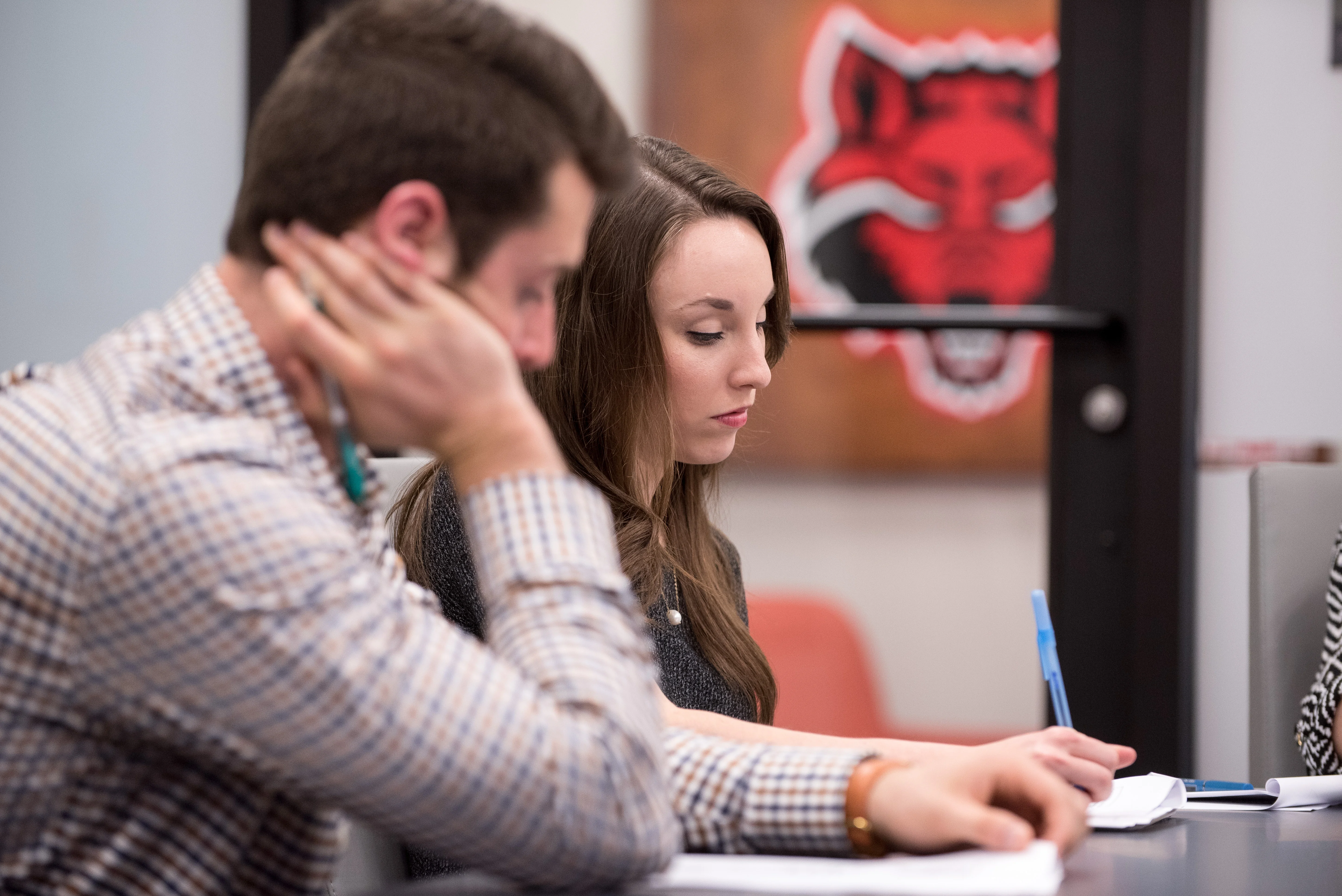 Neil Griffin students studying in the sales center.