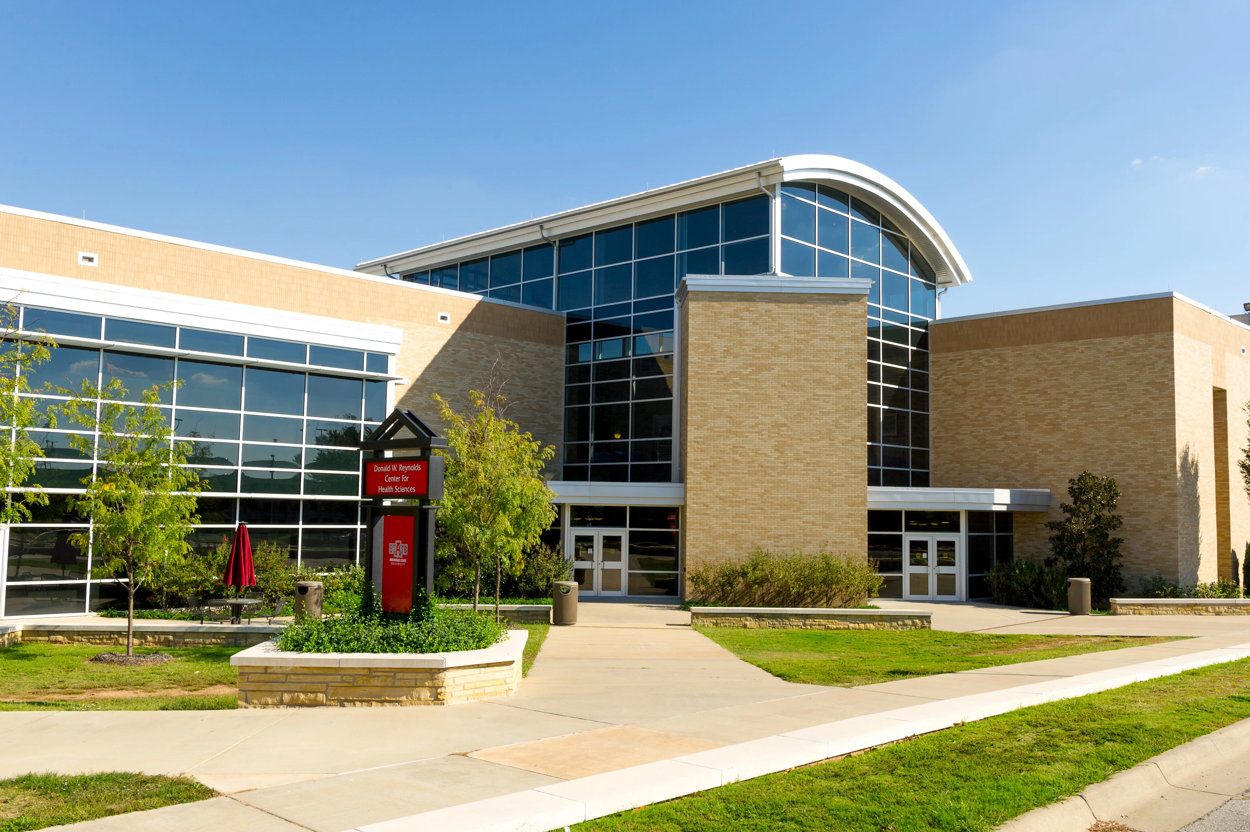 A-State College of Nursing and Health Professions building outside shot on a sunny day.