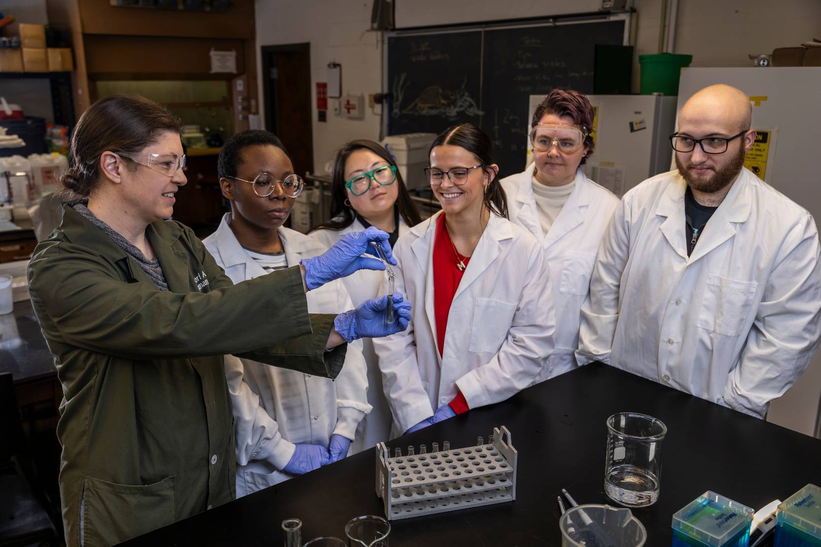 Chemistry class having fun with teacher