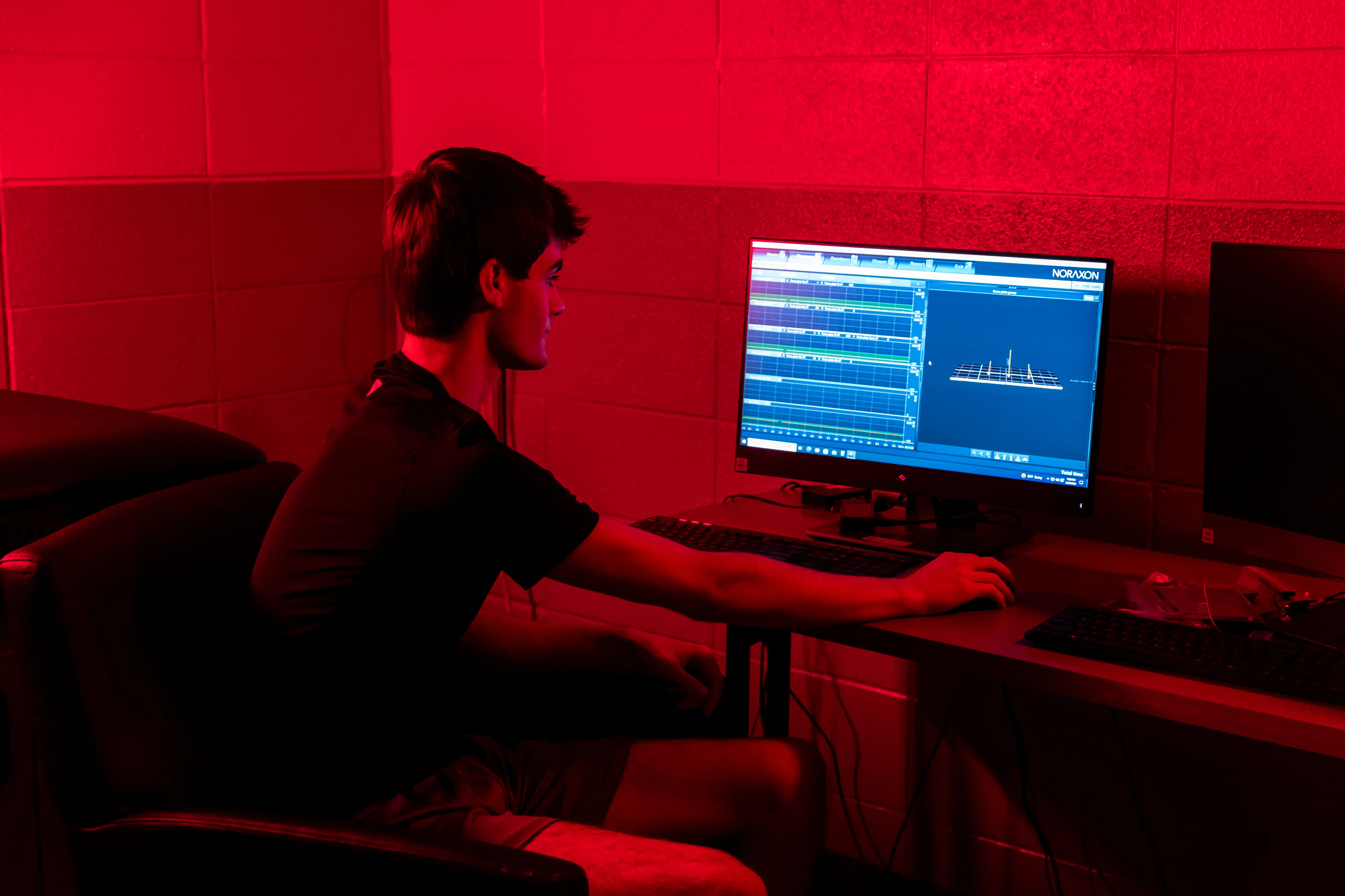 A student looking at biomechanic data.