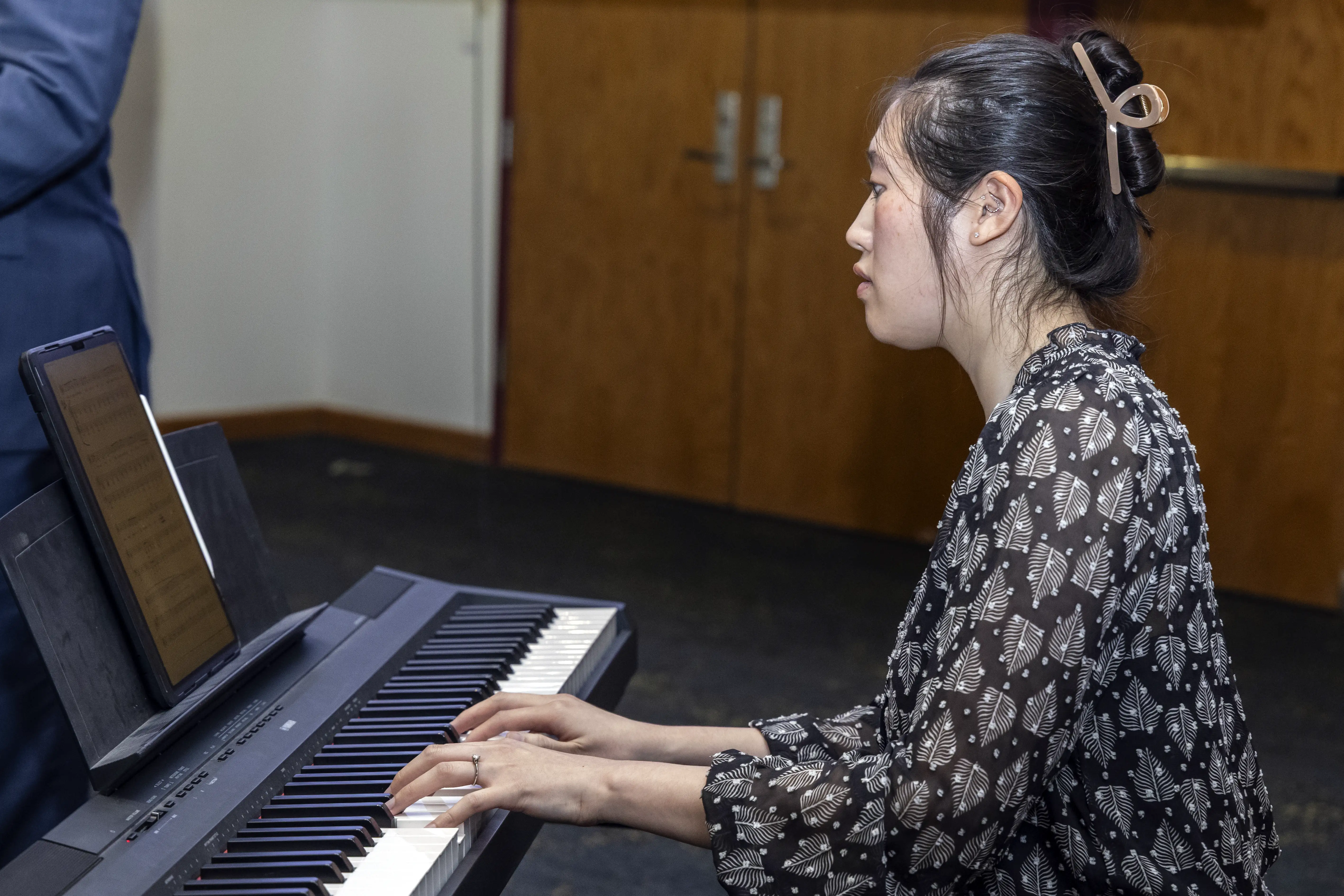 A pianist playing at an A-State awards ceremony.