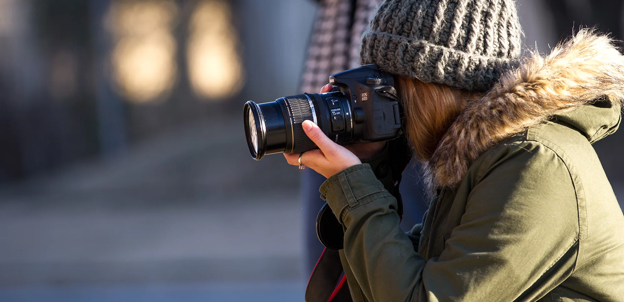 A student taking a photo with a professional camera.