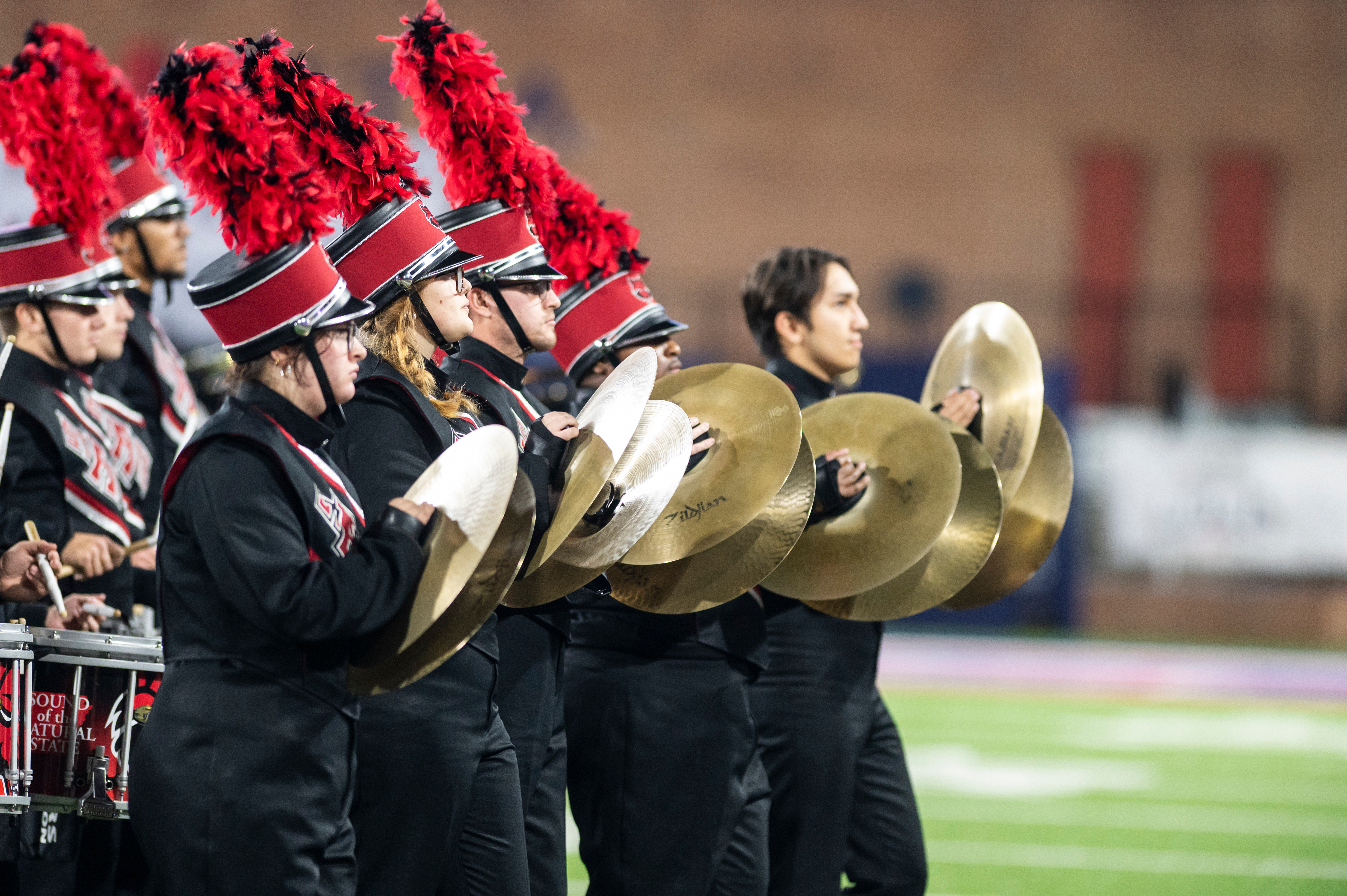 A photo of the A-State Band as they play with cymbals.