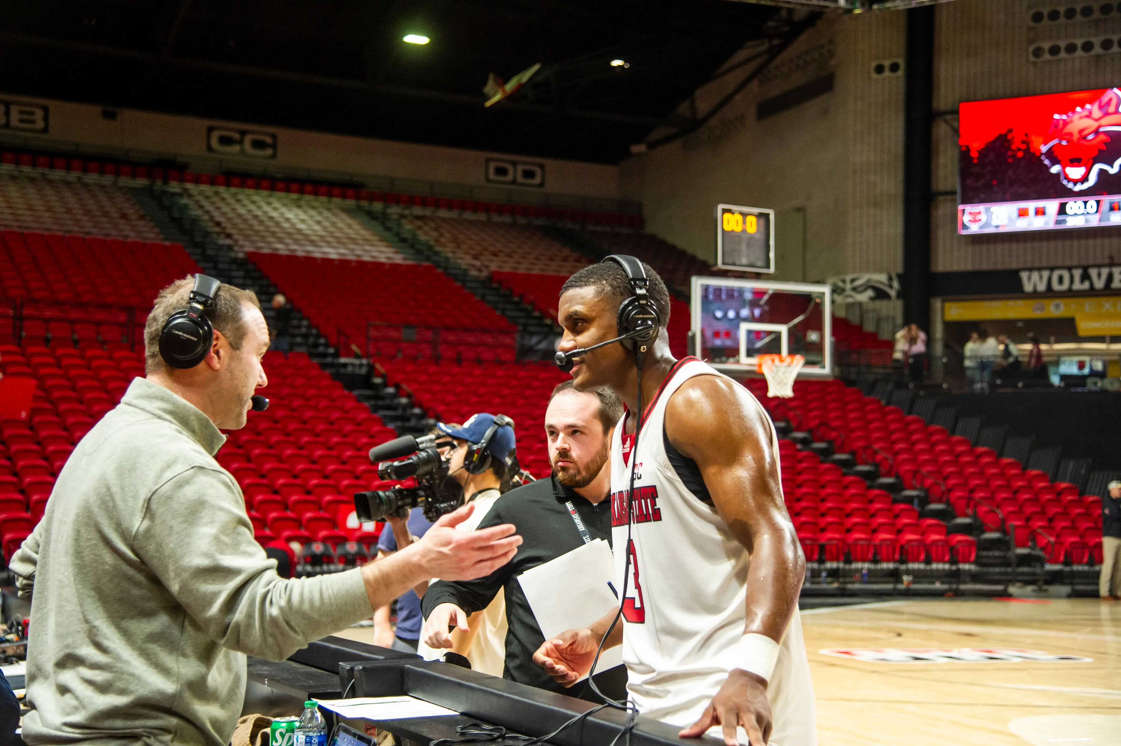 A member of the Arkansas State Red Wolves men's basketball team being interviewed.