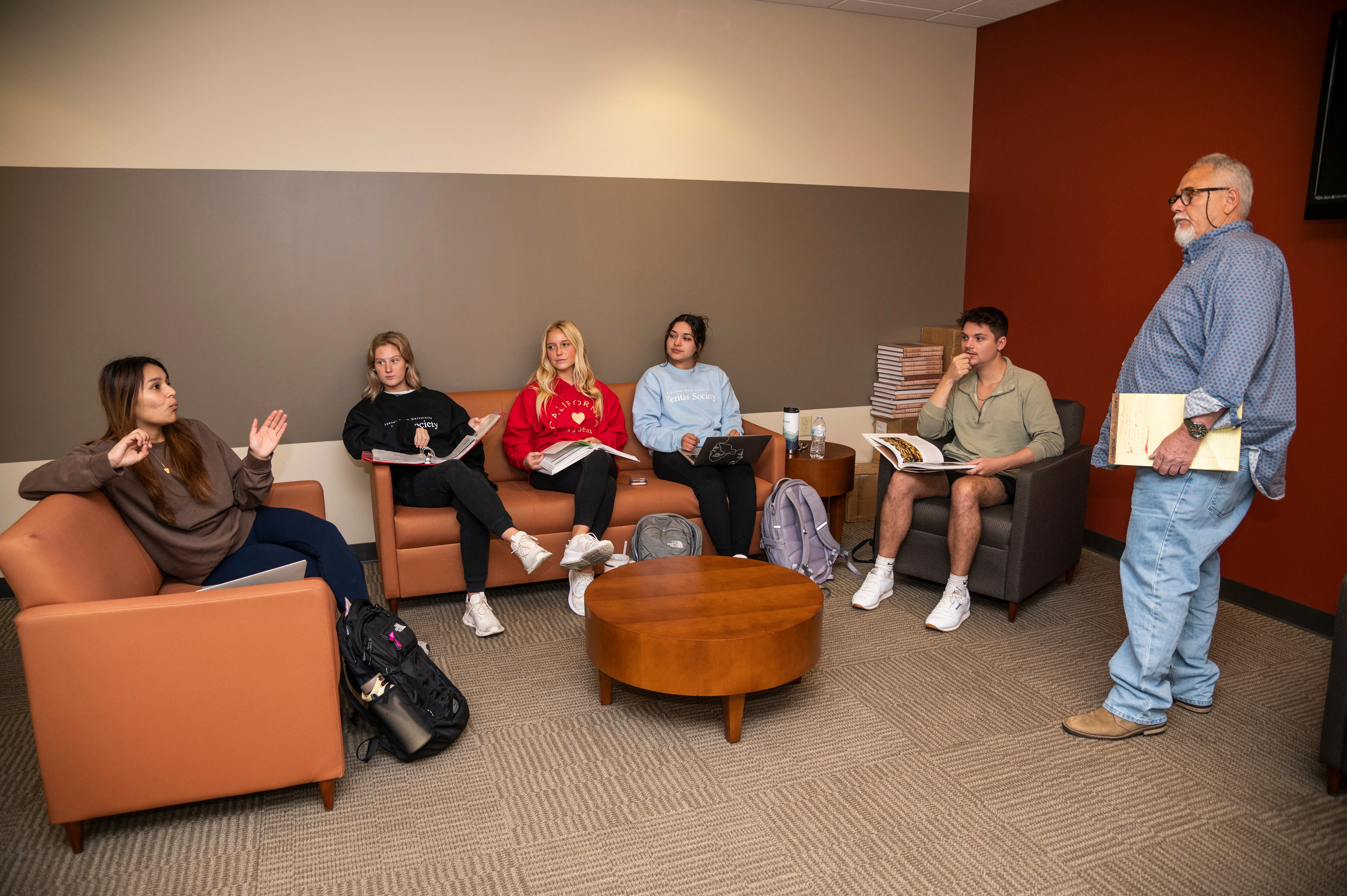 Teacher and students in banking lounge