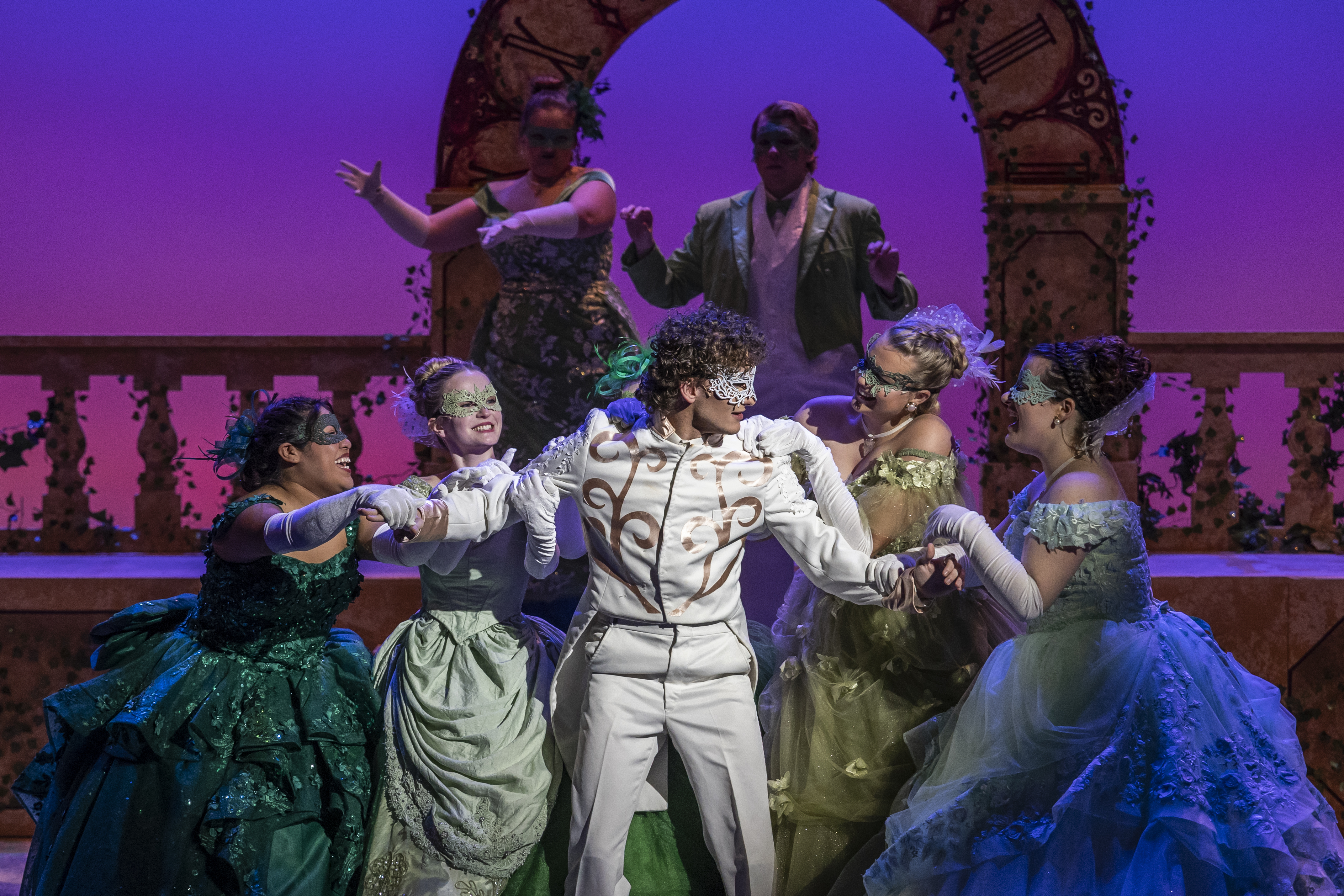 Supporting ensemble looks to a central actor.