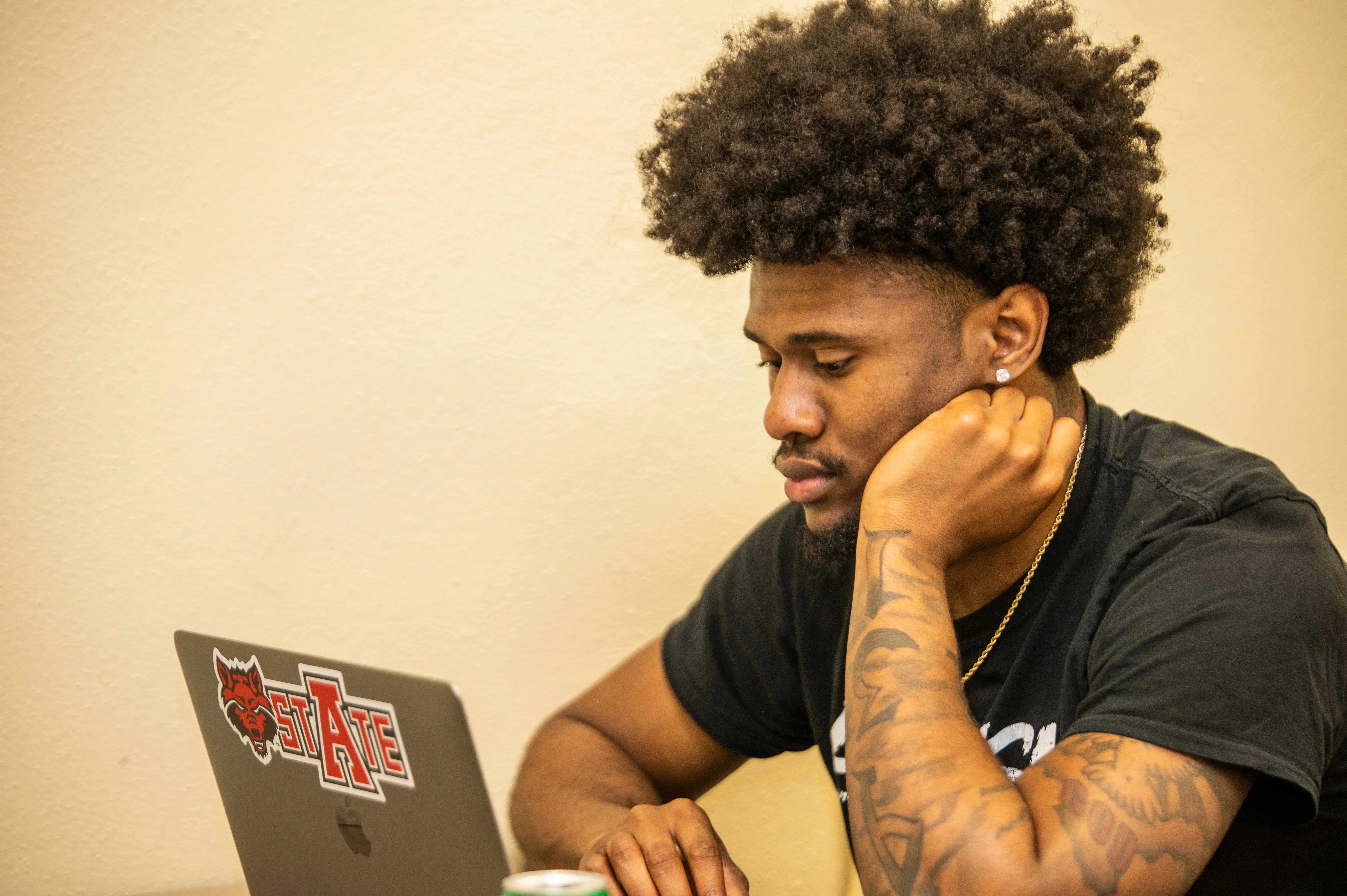 Accountant working from home next to dog.
