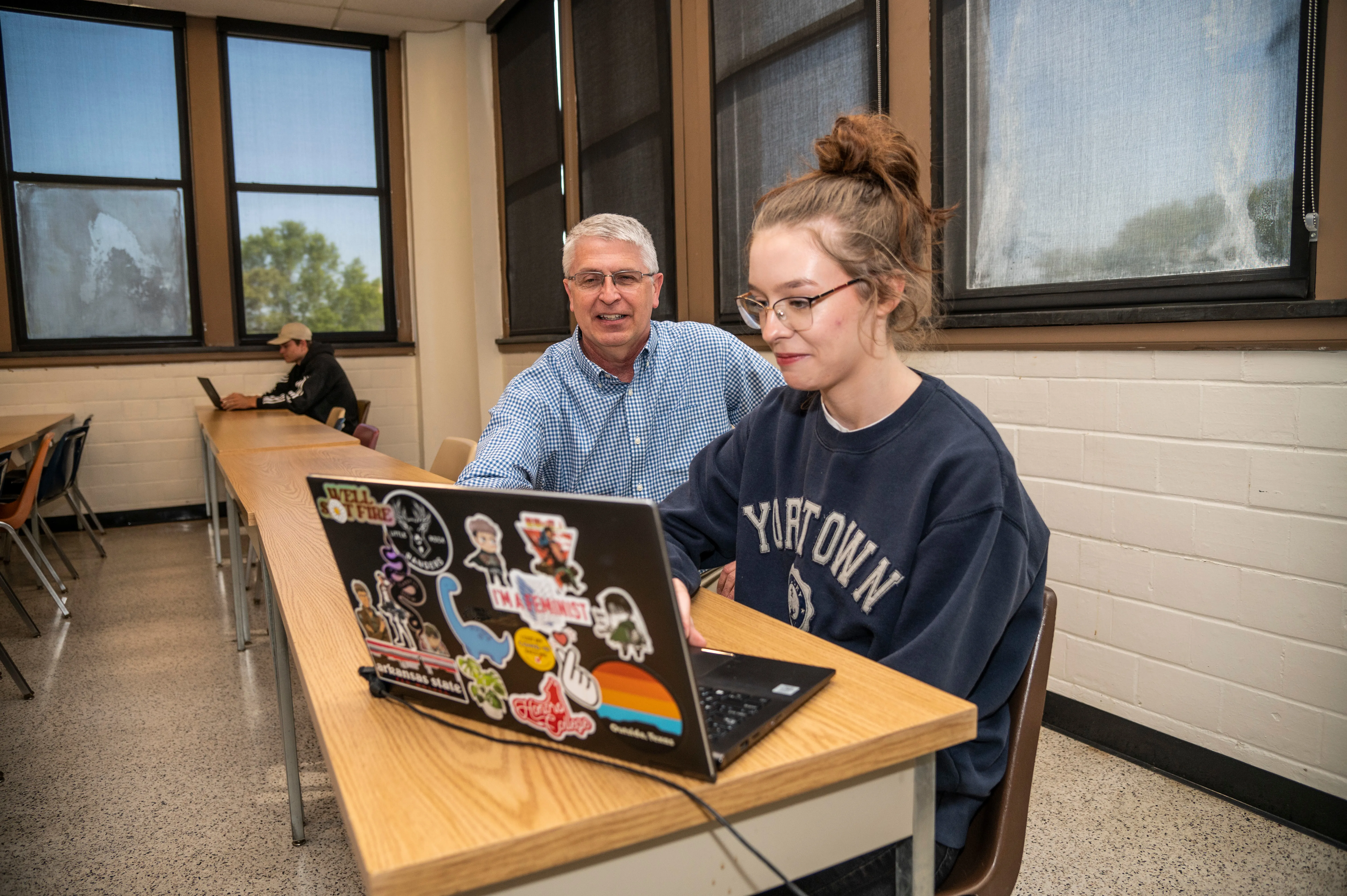 Student and professor at AState working on assignment.