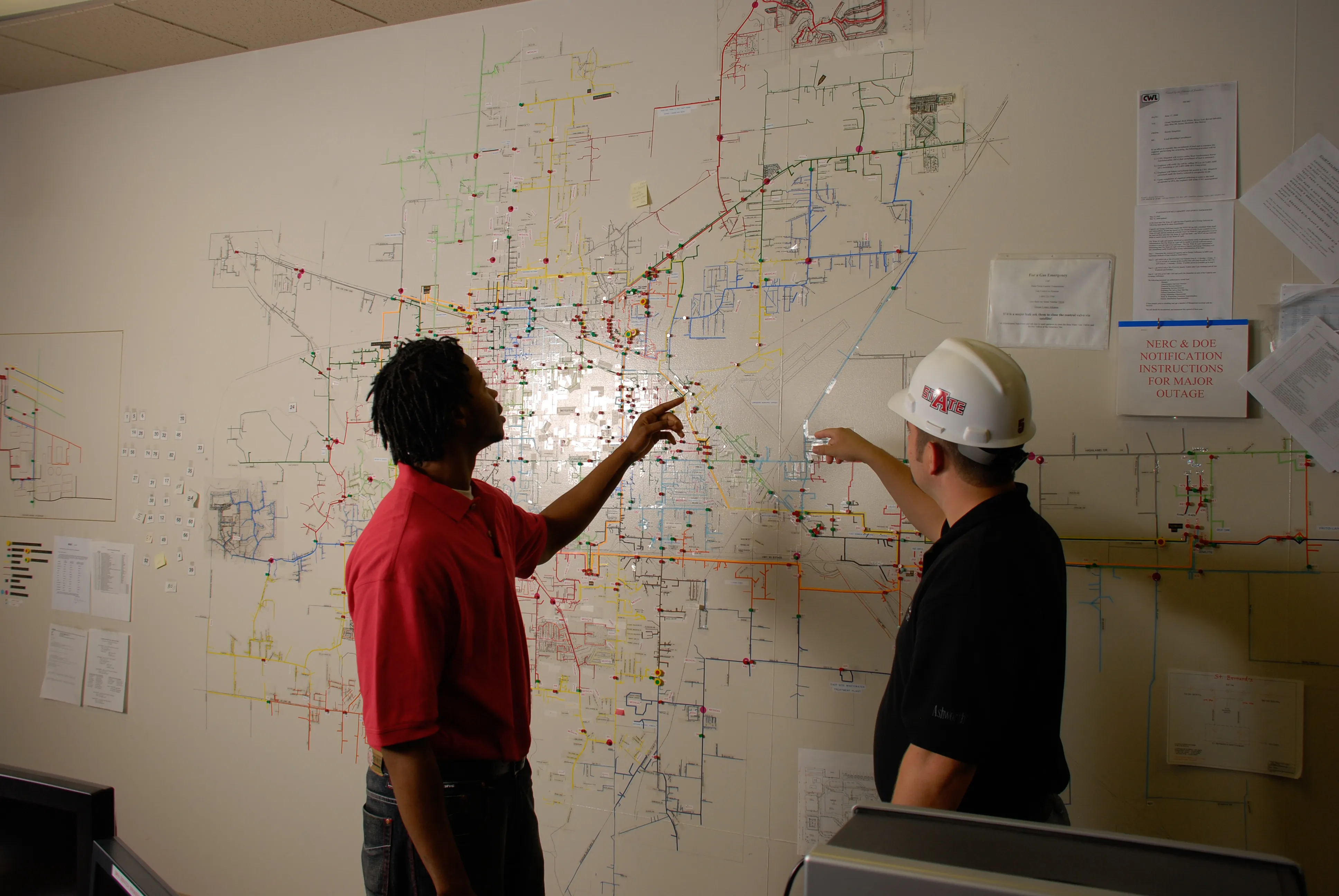 A-State Civil Engineering Students working on a map of the city.