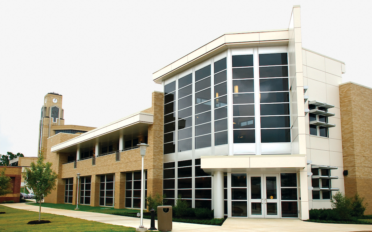 A street view of the Delta Center for Economic Development with clock tower in background.