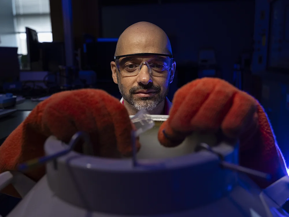 A scientist at ABI working with wires.