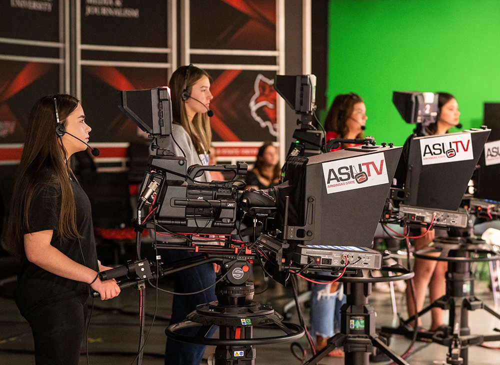 Students operating cameras in the ASU-TV studio.