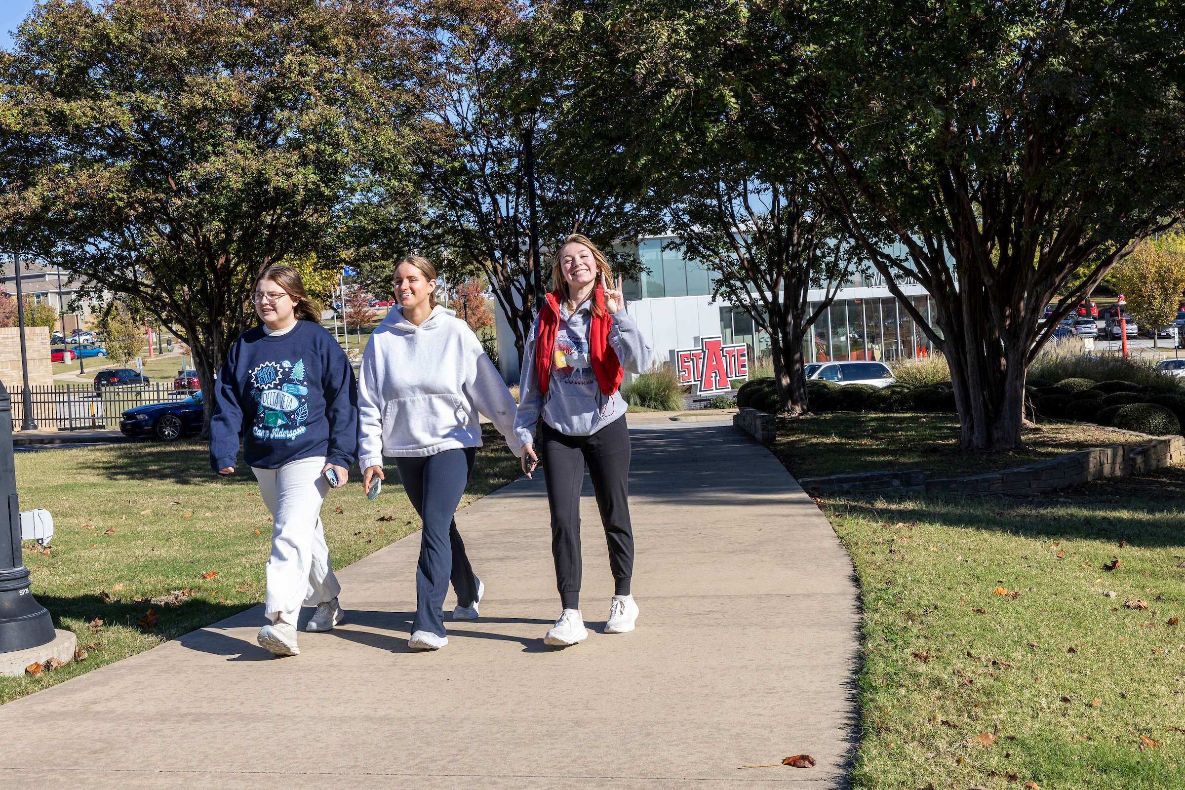 Students walk from the Welcome Center to the campus core.
