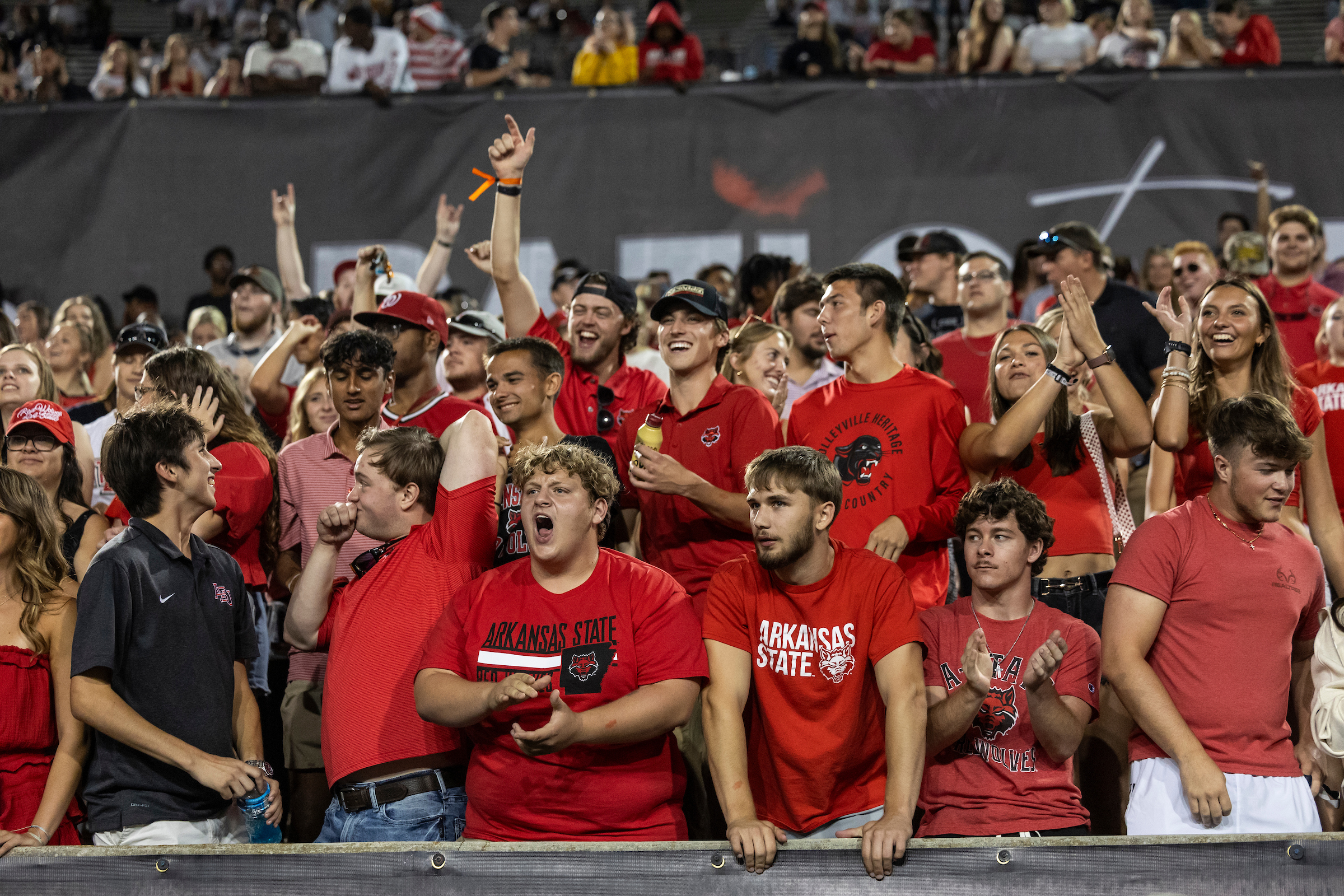 A-State students cheer on the Red Wolves from the student section of Centennial Bank Stadium