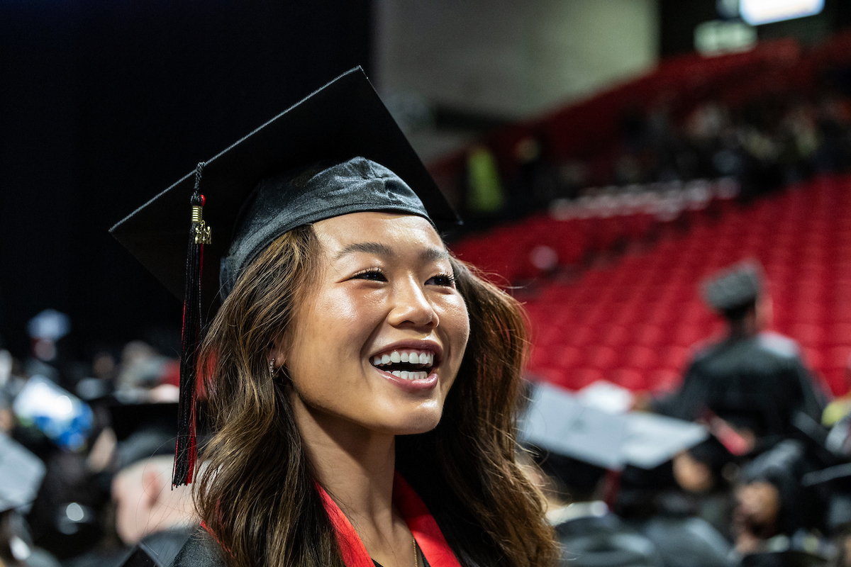 Graduate smiling at commencement 