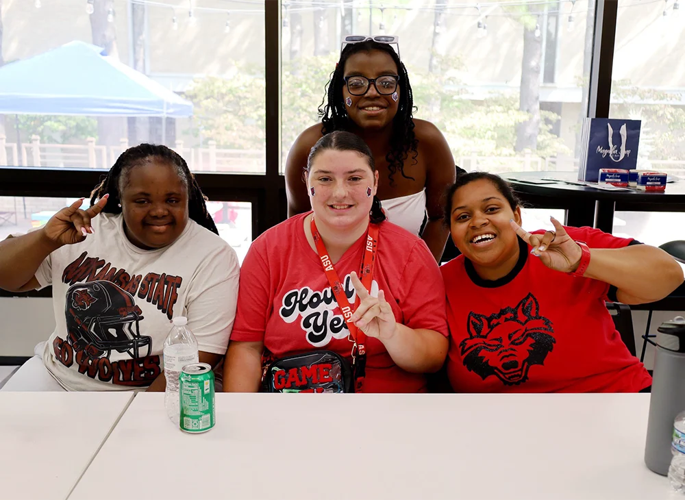 H.O.W.L. Transition Program students and staff giving Wolves Up.