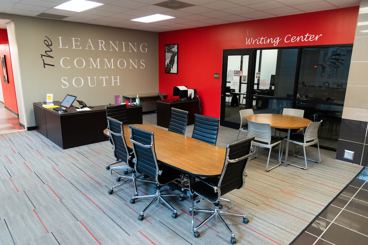 A-State’s Learning Commons South and Writing Center with seating area and help desks.