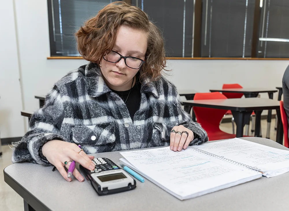 Student using a calculator.