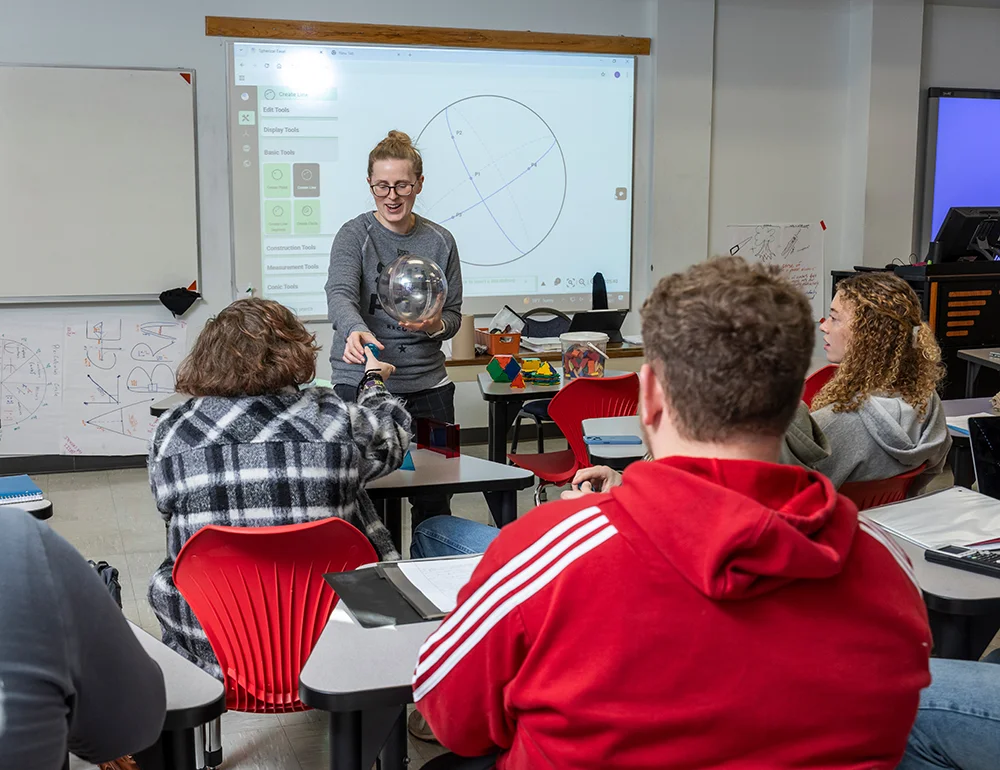 A math teacher teaching a class.