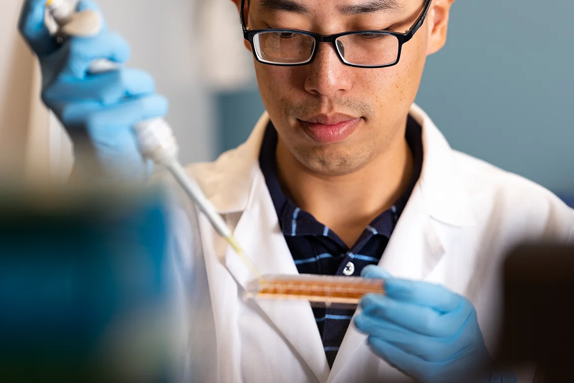 A professor testing chemicals.