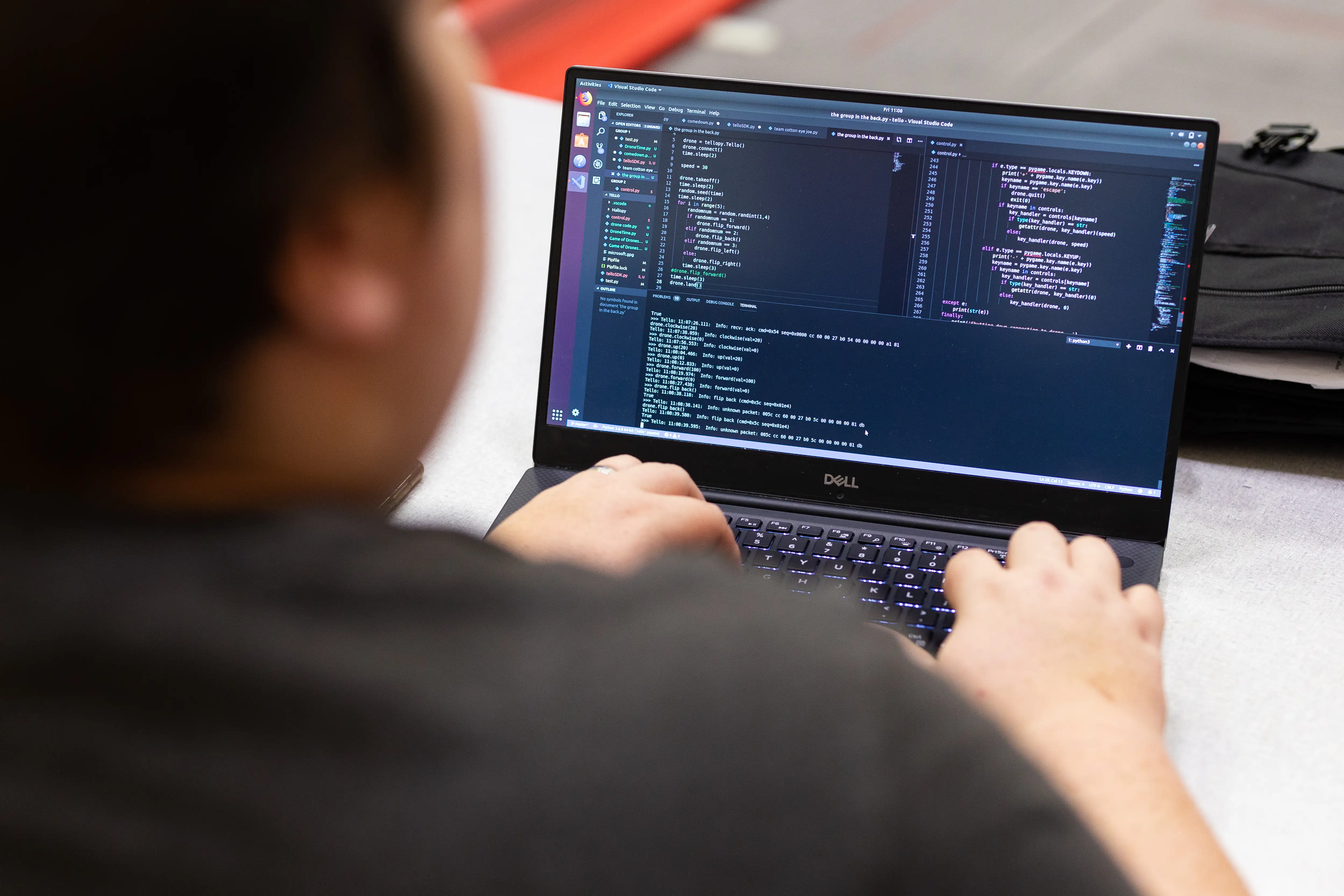 Coding event with students coding drones.