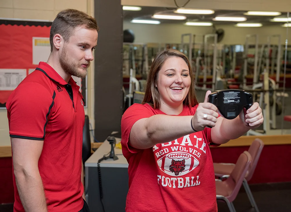 Student testing her hand grip strength.