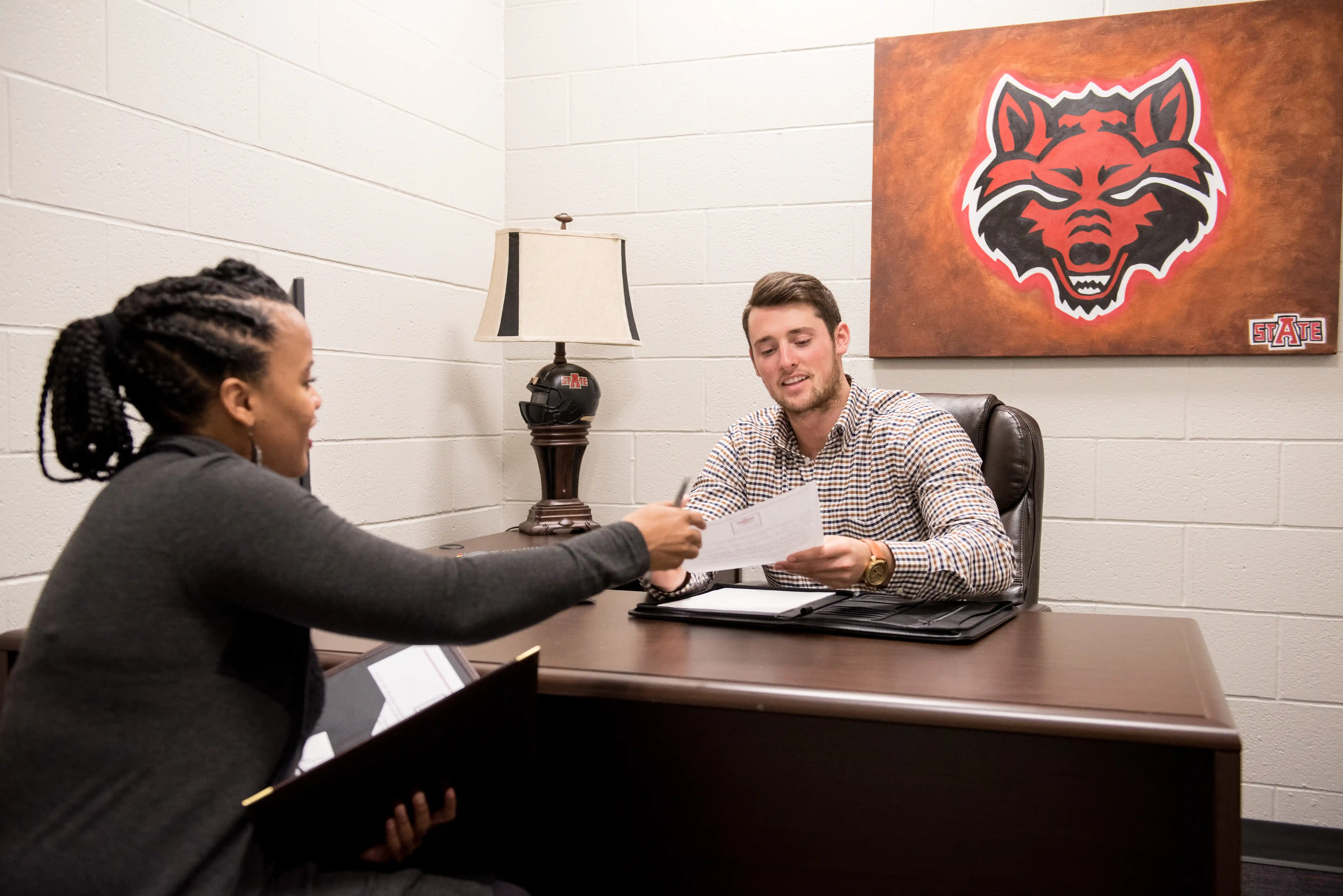 A-State business students performing mock trials in their class in the sales leadership center.