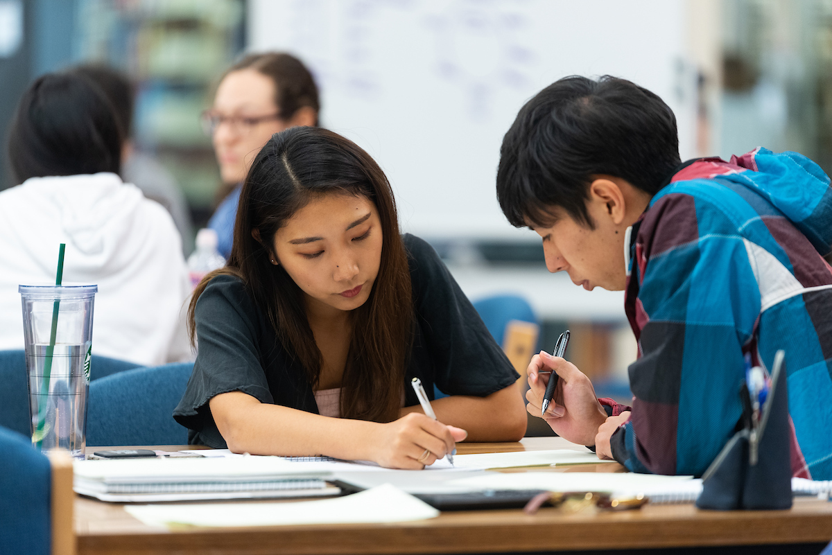 A-State students studying together in library