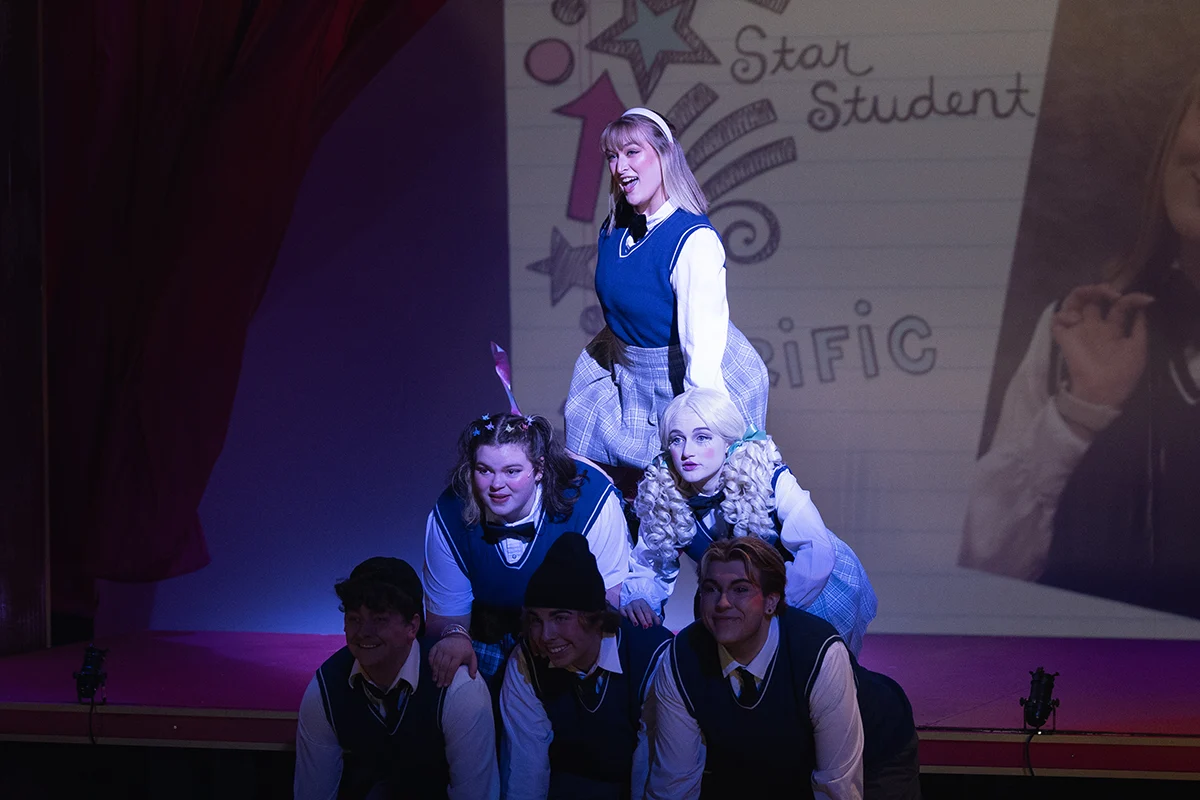 Actors forming a pyramid in "Ride the Cyclone"