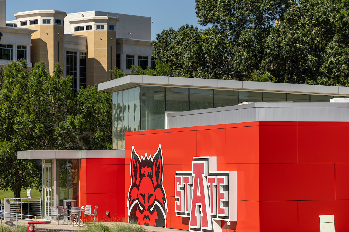 A-State Welcome Center featuring Red Wolves logo and modern red facade.