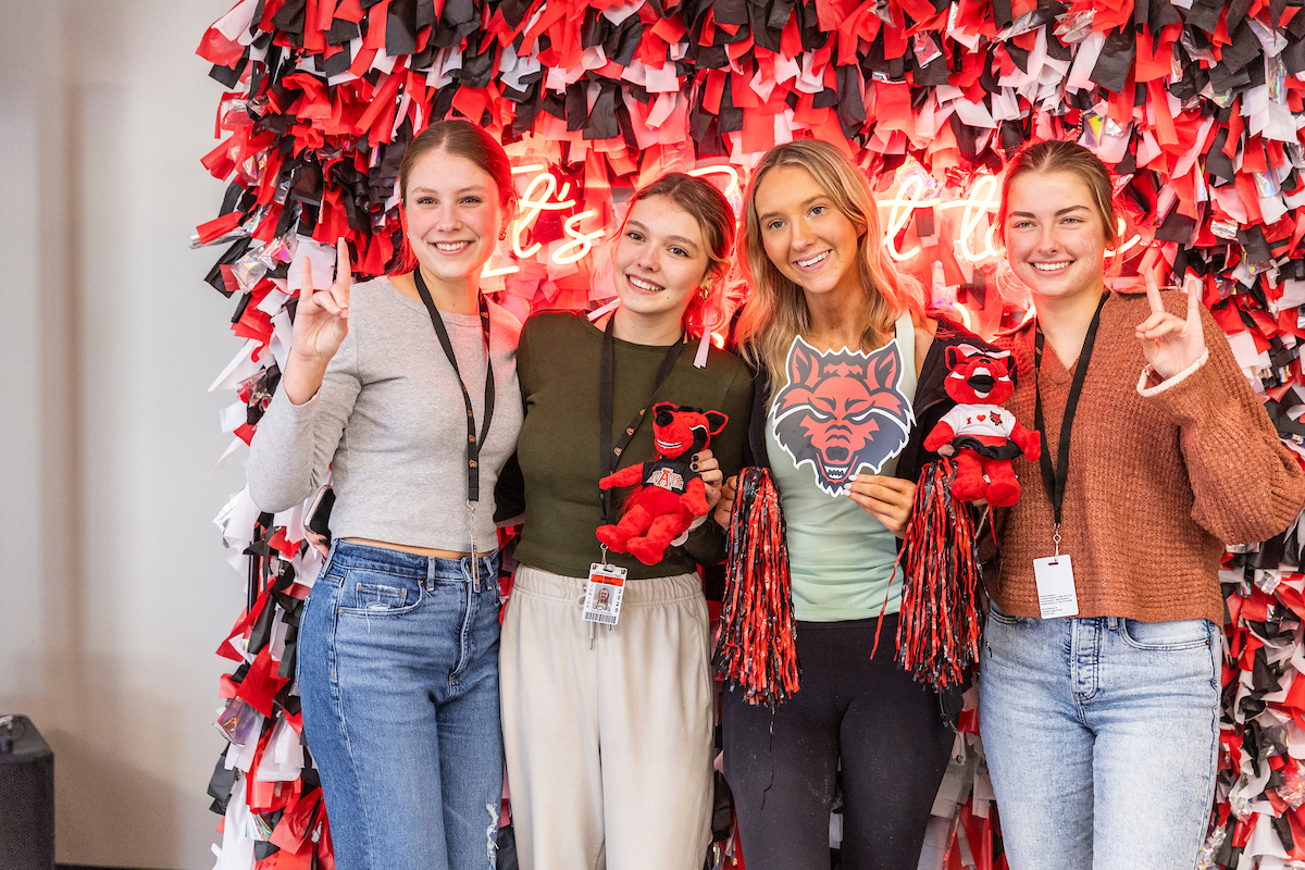 Students at an area high school pose together for a group photo at an A-State event.