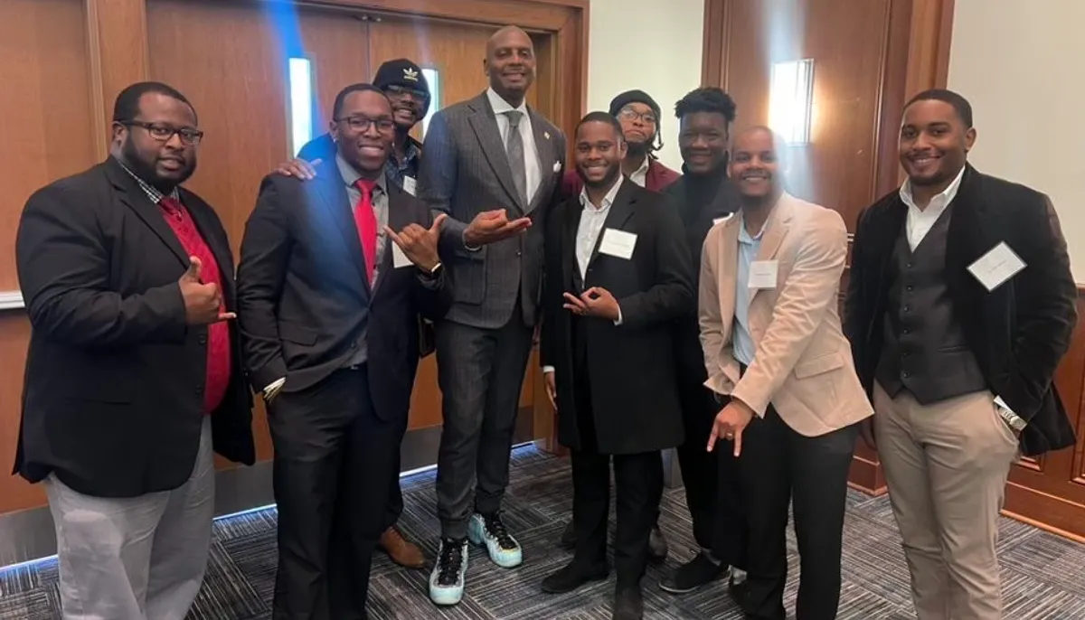 A group of Brother 2 Brother members pose at an event