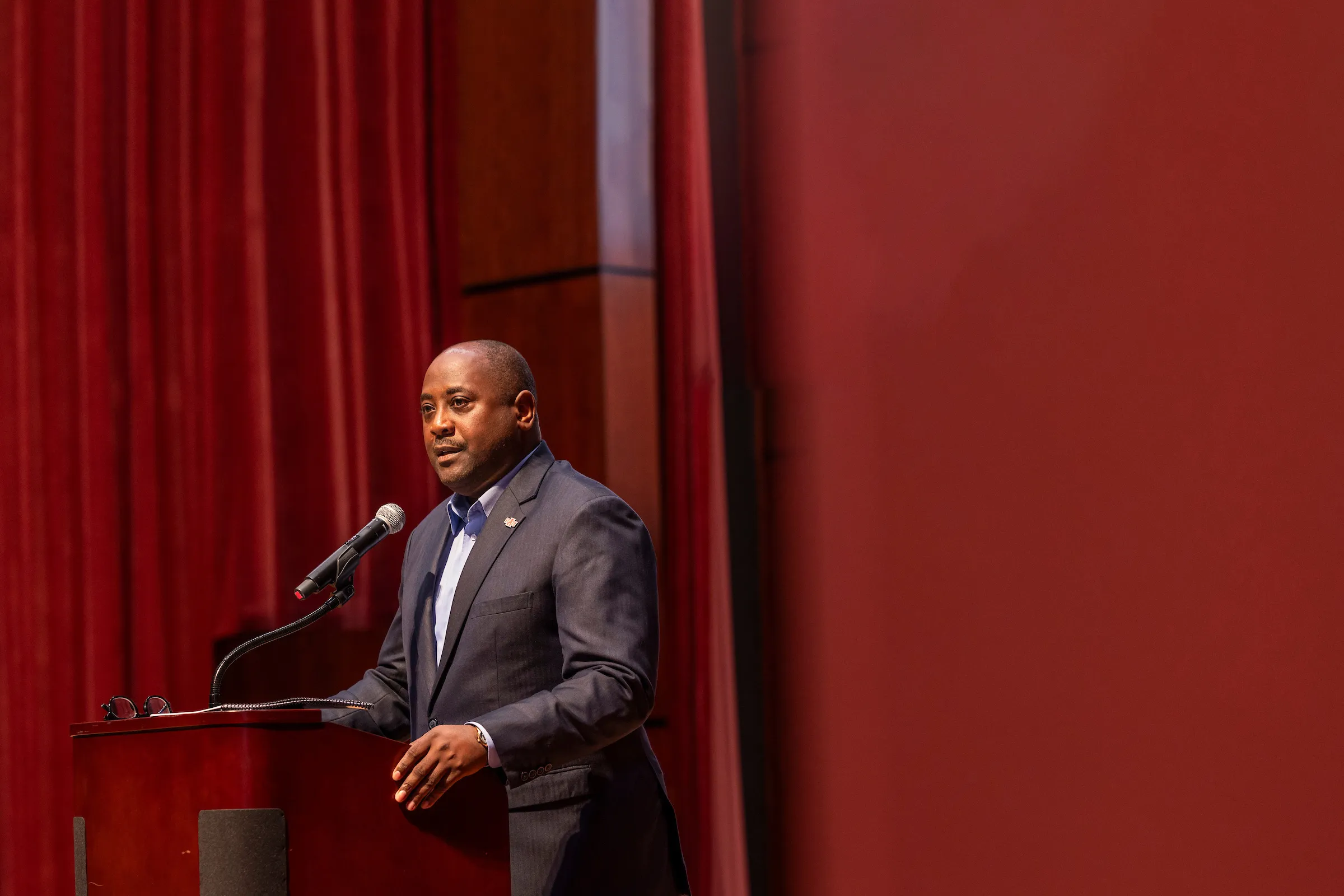 Calvin White speaks to an auditorium during faculty conference.